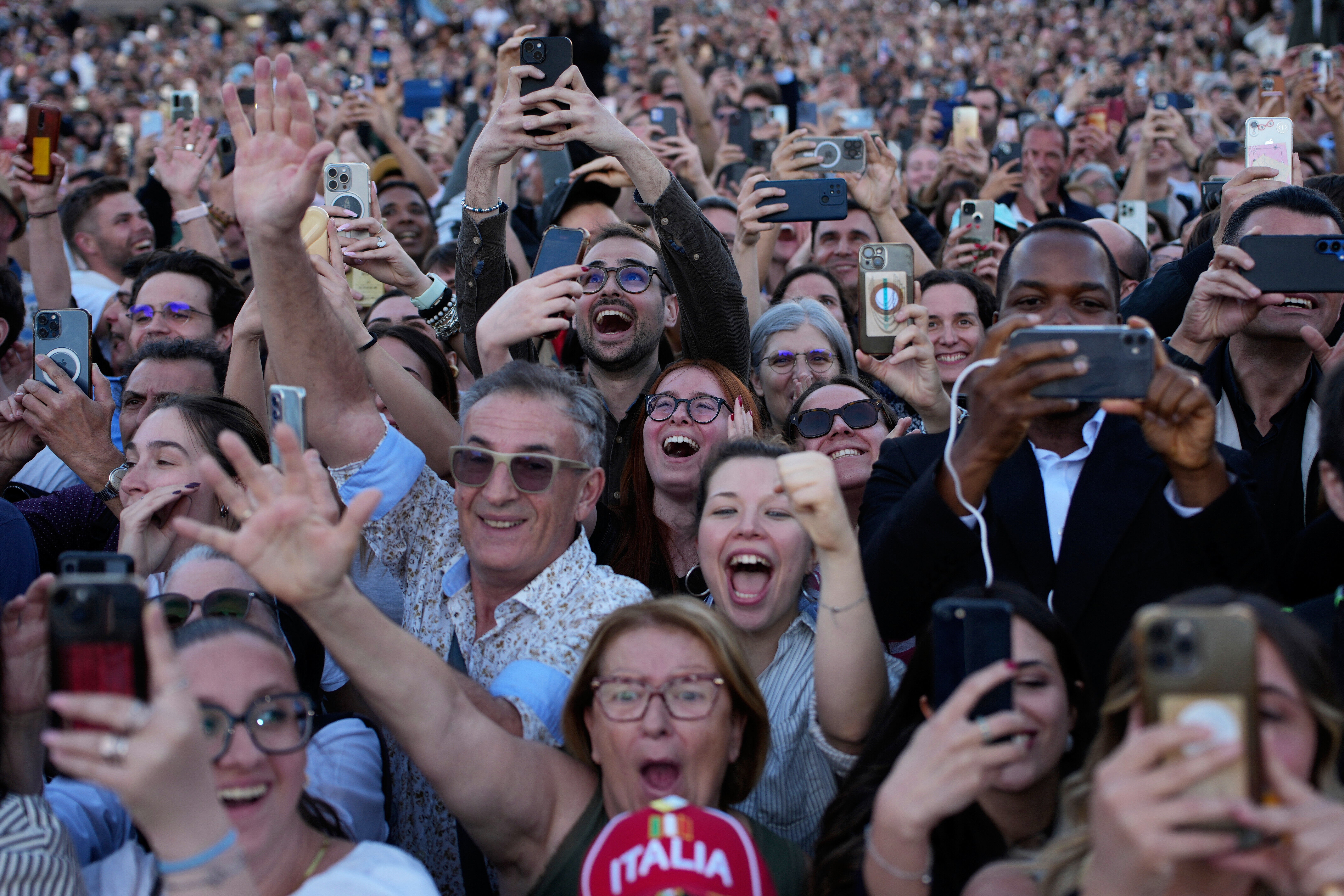 People react as the newly elected Pope Leo XIV appears on the balcony of St. Peter's Basilica at the Vatican, Thursday, May 8, 2025