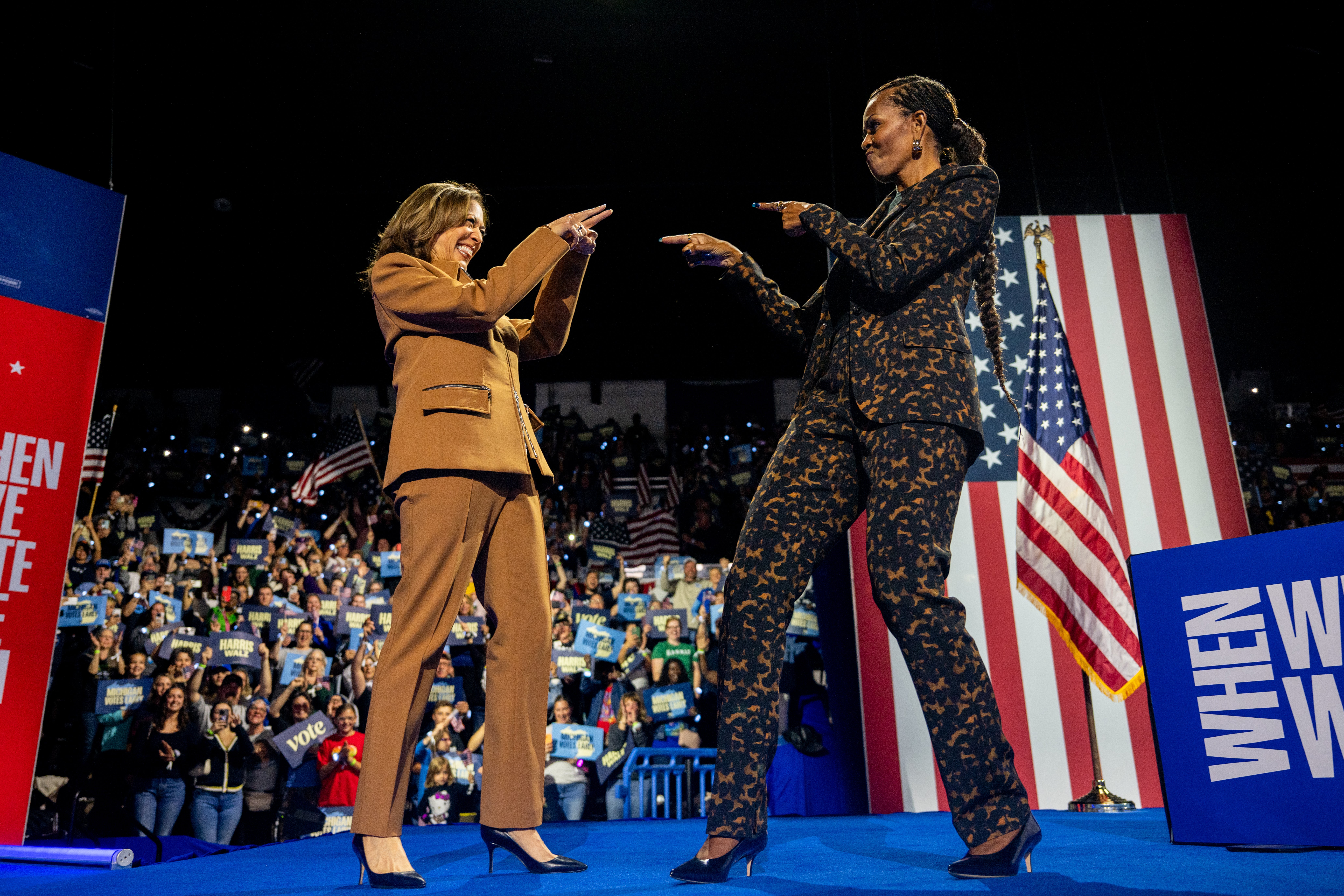 Kamala Harris greets former first lady Michelle Obama during a campaign rally