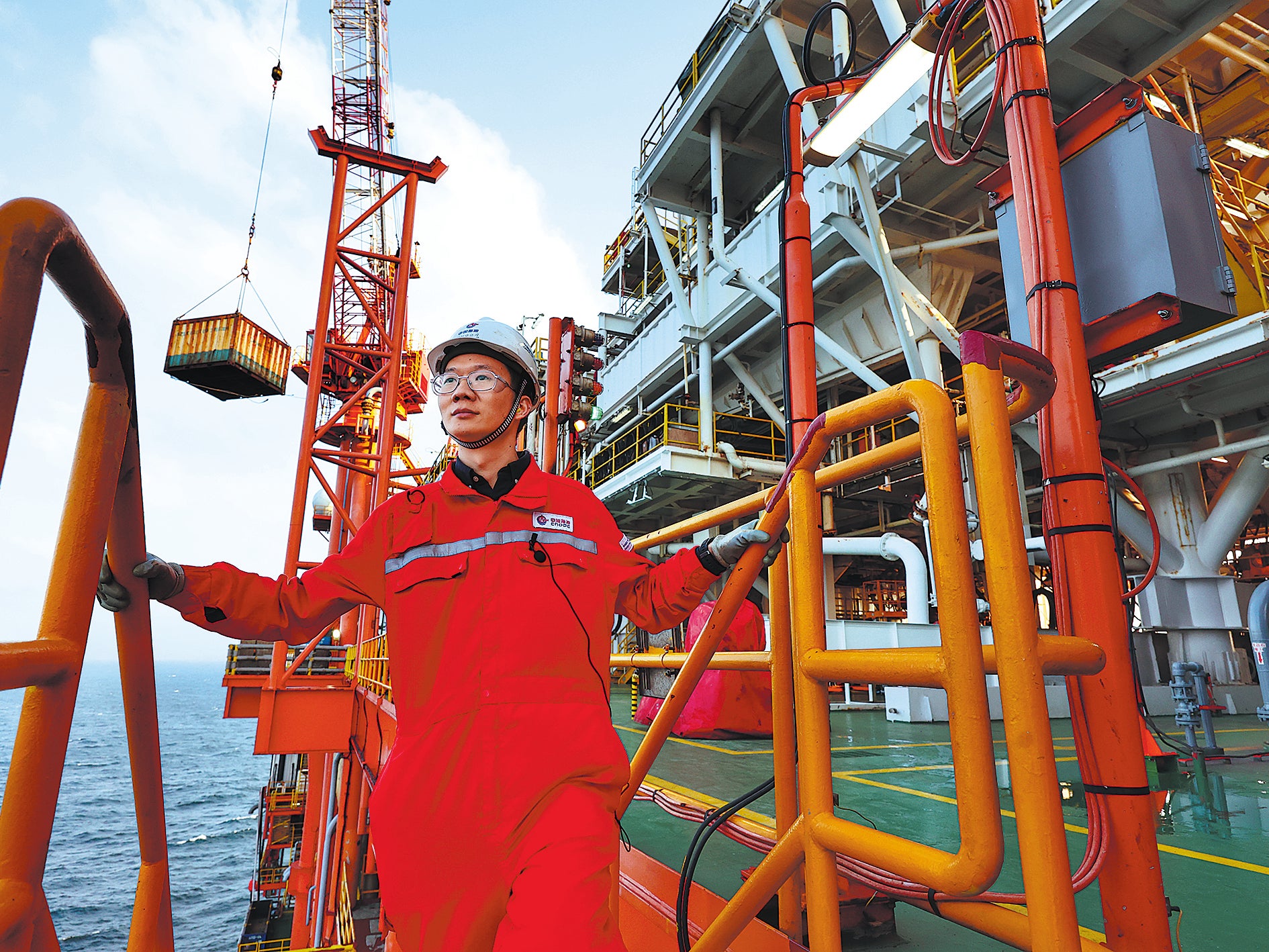 Li Wei, an offshore installation manager of the oil platform, inspects operations
