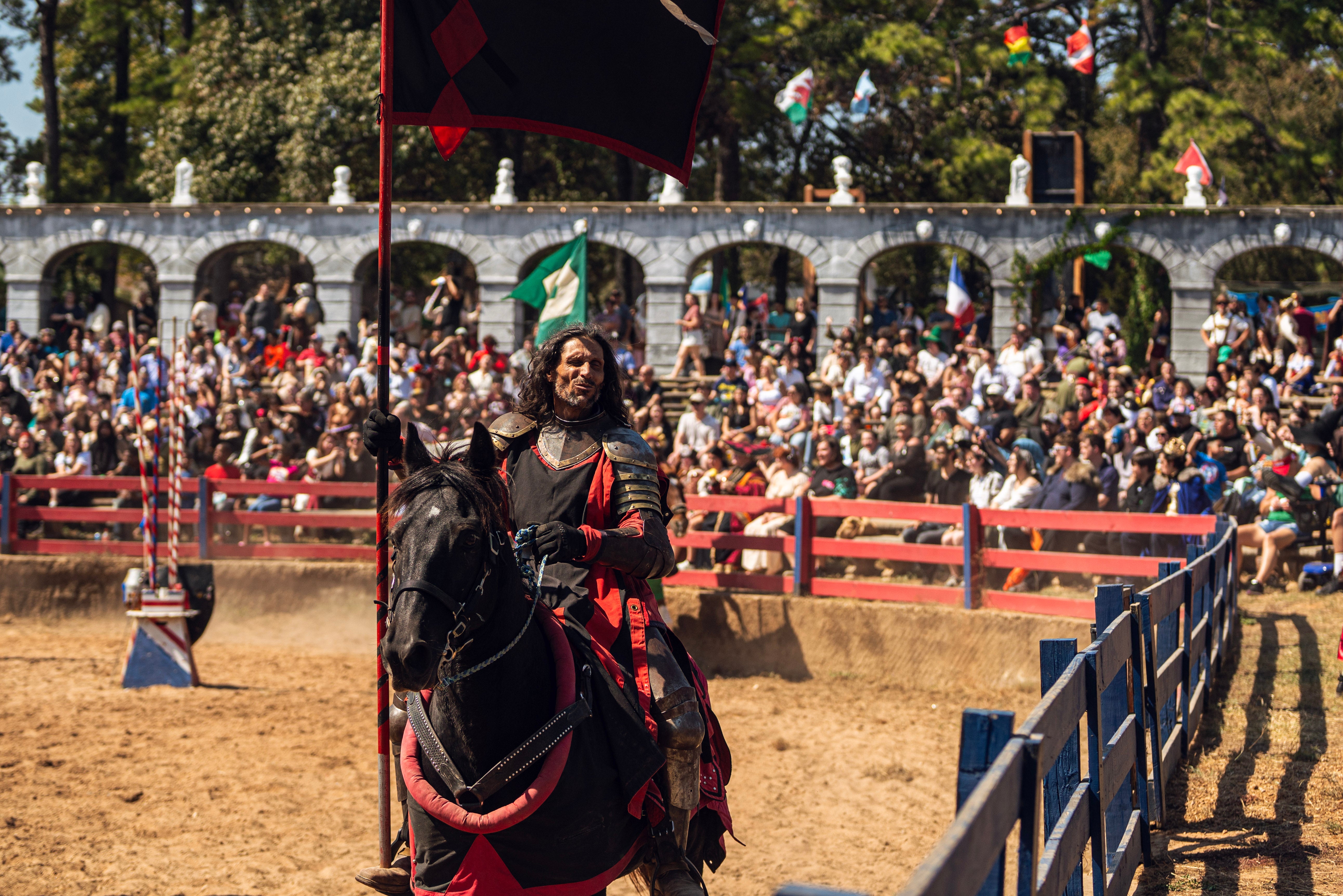 A joust participant rides a horse at the Texas Renaissance Festival in Todd Mission, Texas. The festival's owner, ‘King’ George Coulam — has been ordered by a judge to sell the festival for $60 million and to pay $22 million in damages to a group who sued him after he allegedly backed out of a sale agreement