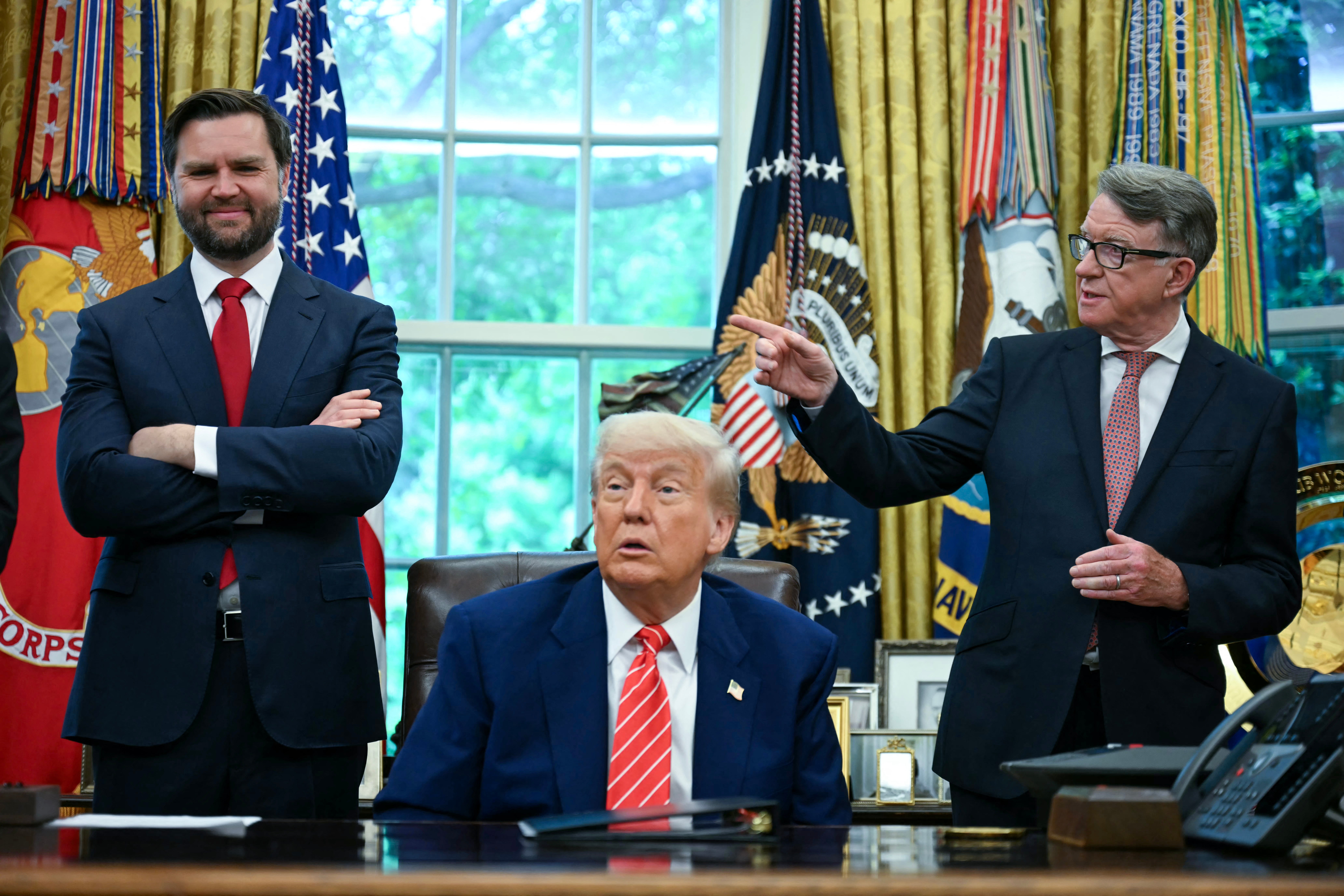 President Donald Trump pictured with Vice President JD Vance and British Ambassador to the U.S. Peter Mandelson shortly after the U.S. struck a trade deal with the U.K.