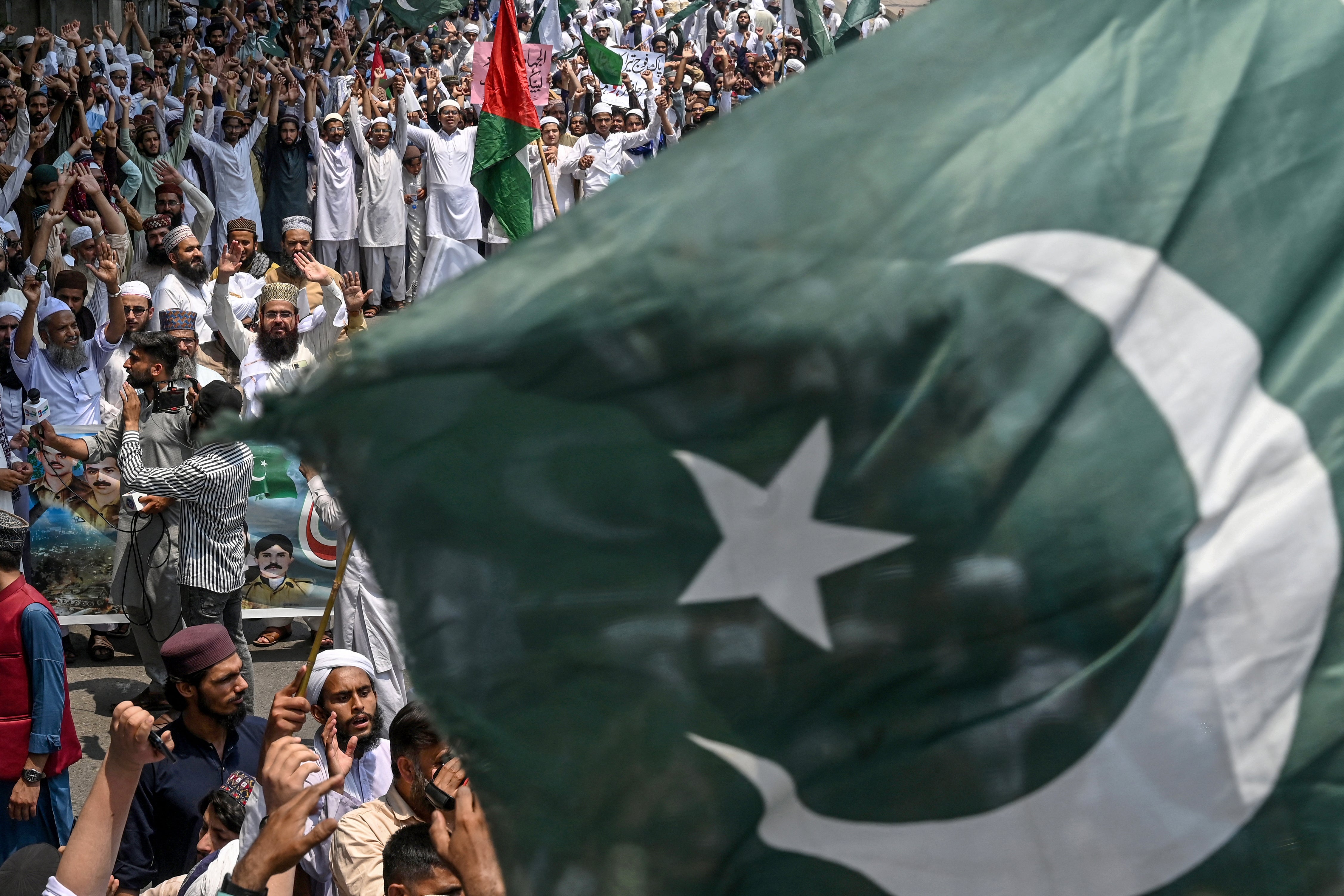 Supporters of the Pakistan Markazi Muslim League party shout slogans during an anti-India protest in Lahore on Saturday