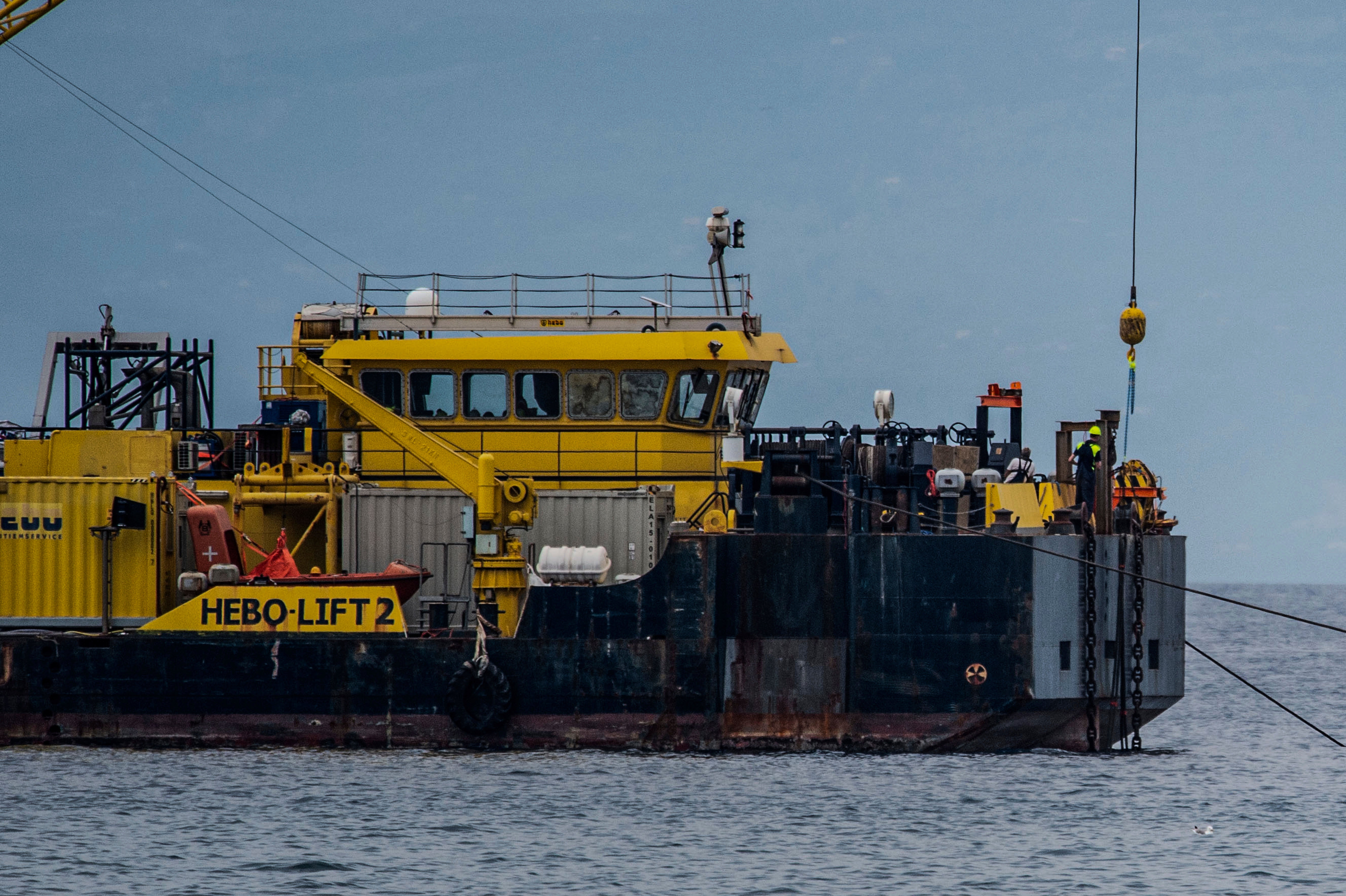 The multi-purpose floating work barge Hebo Lift 2 monitors the stretch of sea off Porticello, near Palermo, Sicily, Italy, Sunday, May 4, 2025, where the British superyacht Bayesian sunk on August 19, 2024 as the operations for its recovery start. (AP Photo/Salvatore Cavalli)