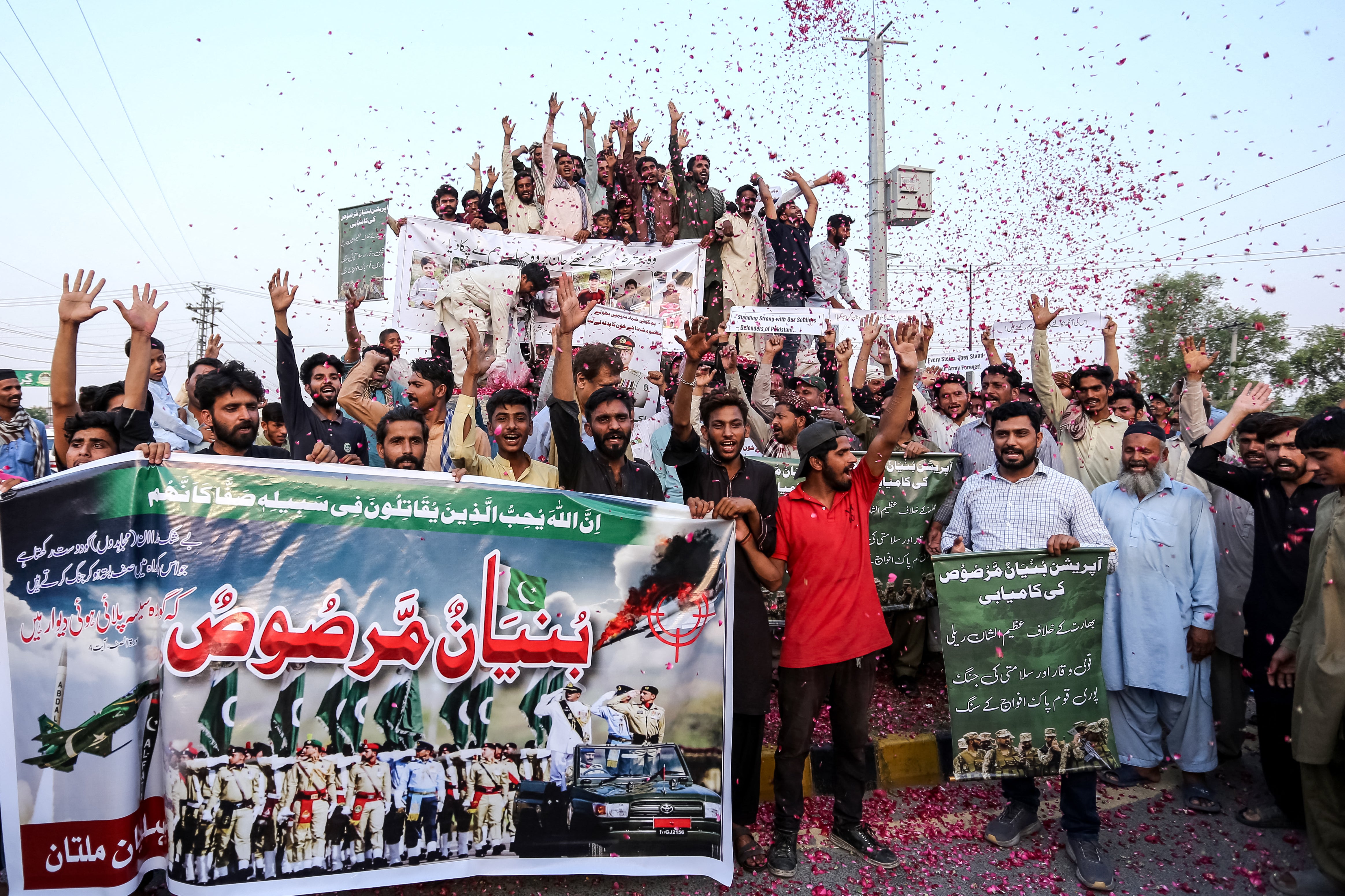 Pakistanis celebrate after a ceasefire with India is announced in Multan on 10 May 2025