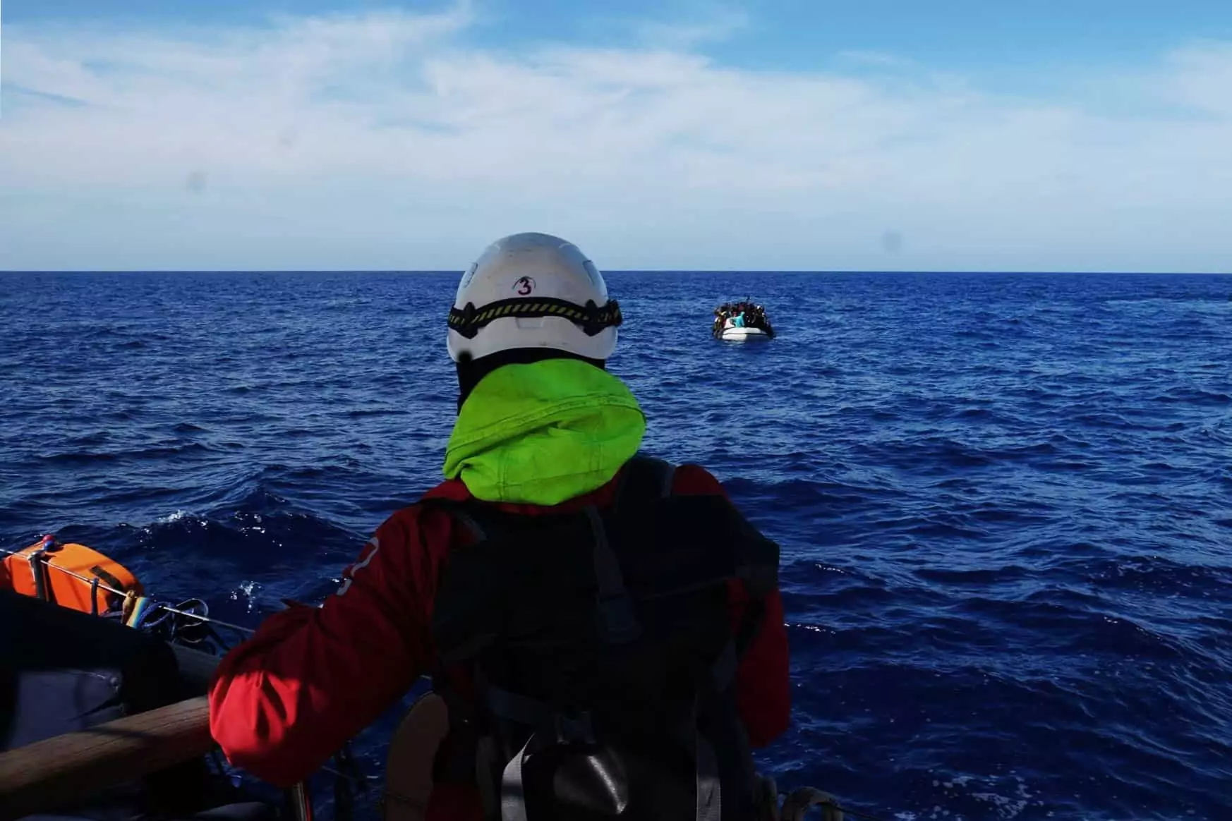 The crowded boat is intercepted at sea