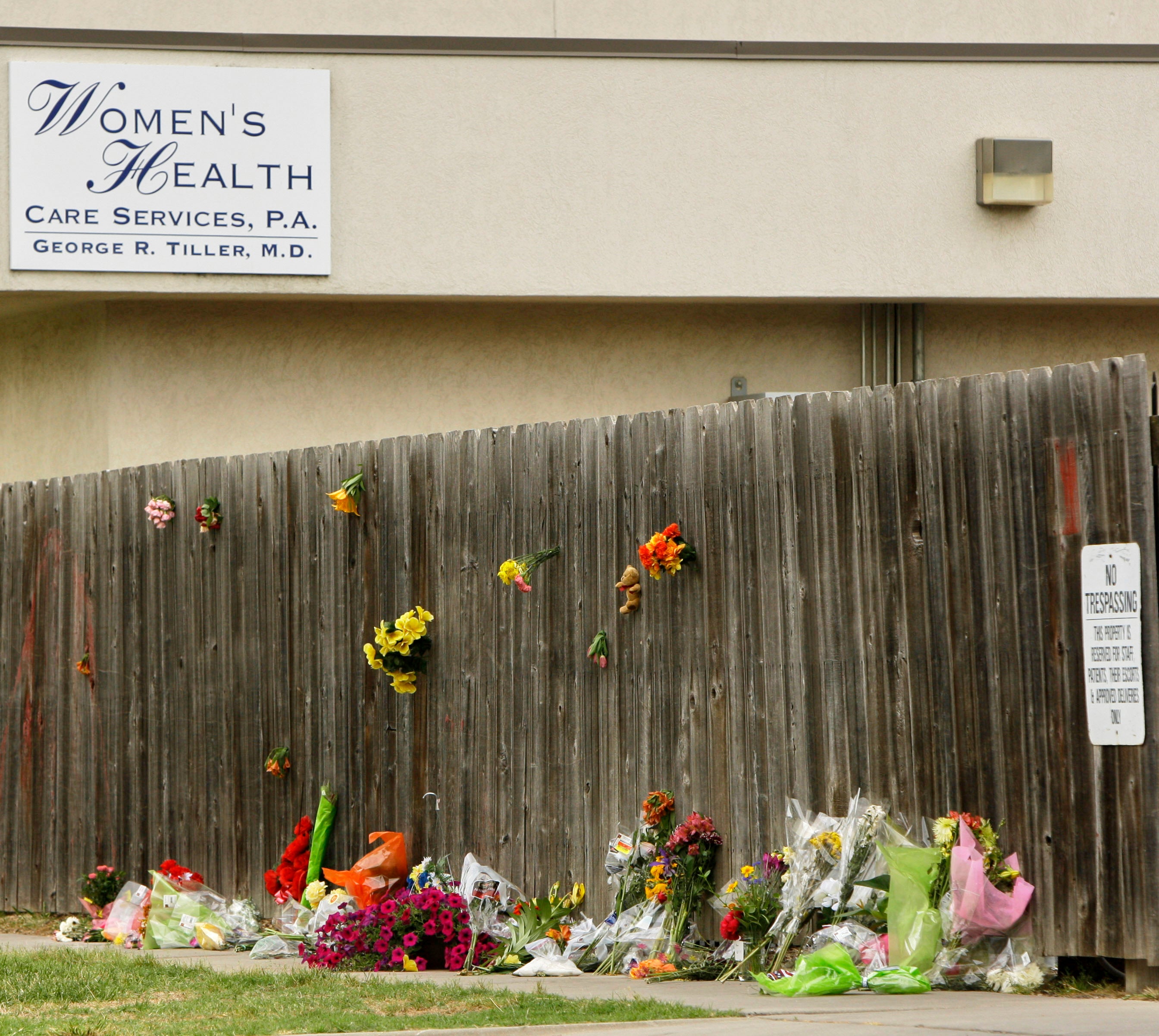 Mementos are placed at a memorial outside Women's Health Care Services owned by Dr. George Tiller in Wichita, Kan., Tuesday, June 2, 2009, after he was fatally shot during church services Sunday. (AP Photo/Charlie Riedel, File)