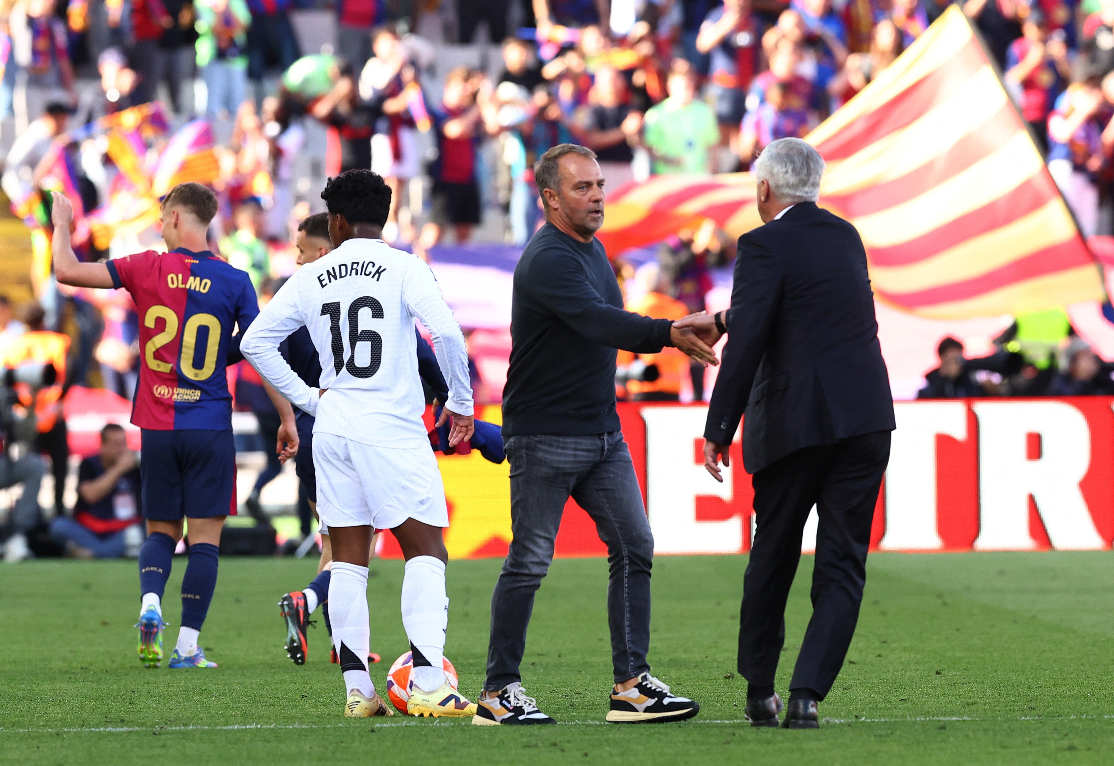 Hansi Flick and Carlo Ancelotti shake hands