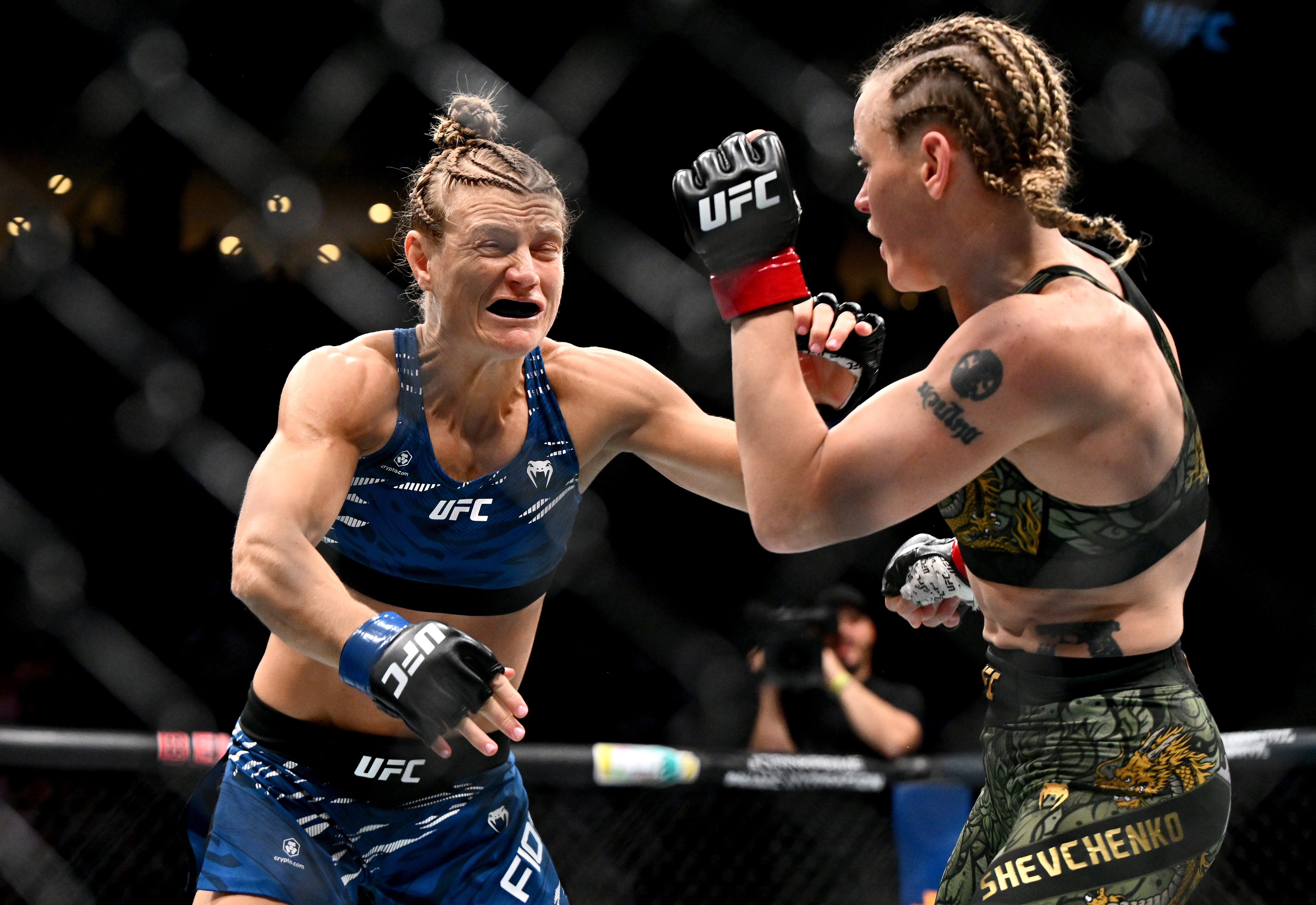 Valentina Shevchenko (right) narrowly outpointed Manon Fiorot to keep her title