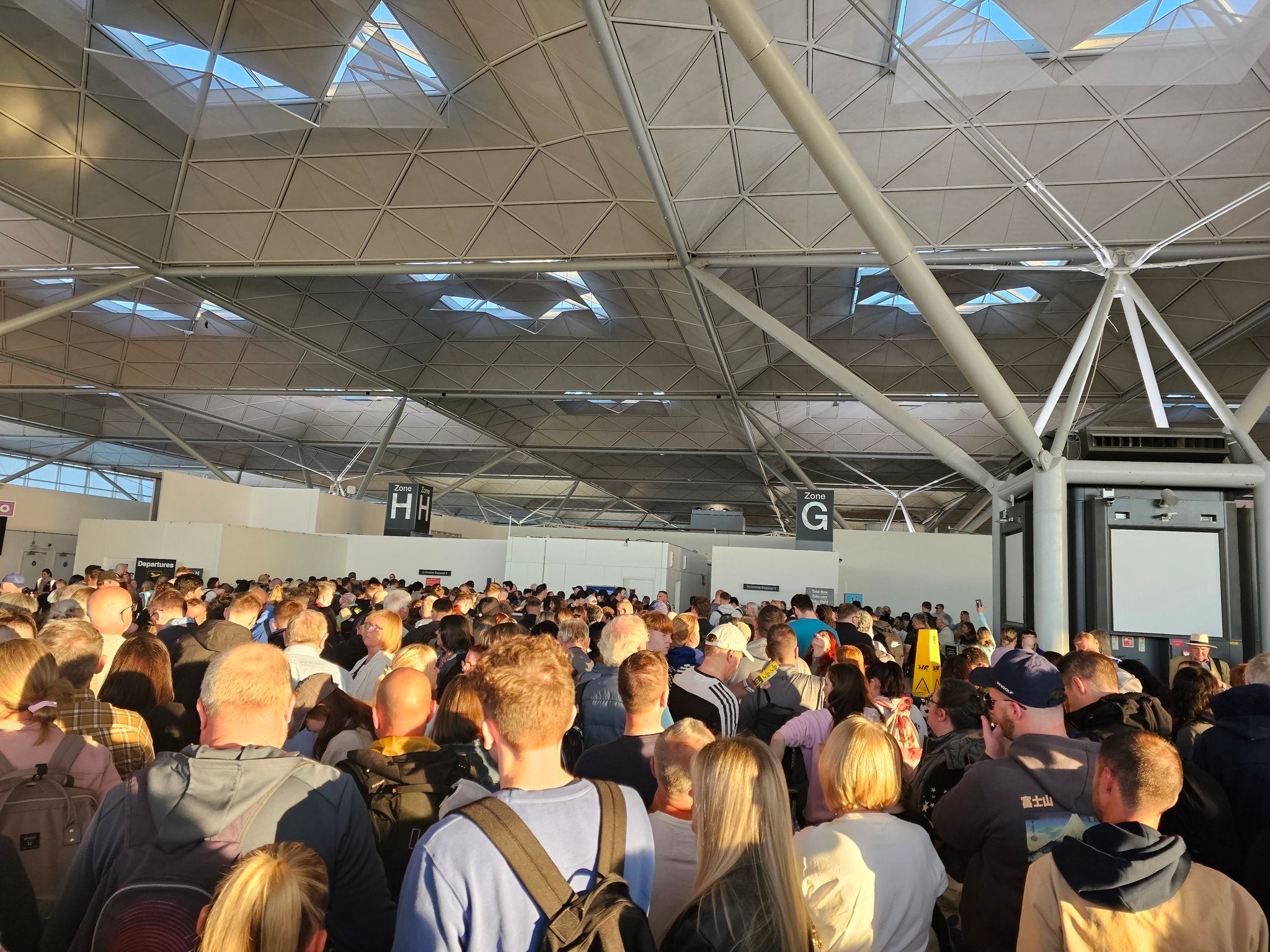 Queues to check-in at Stansted with 30 minutes to go before the flight departs