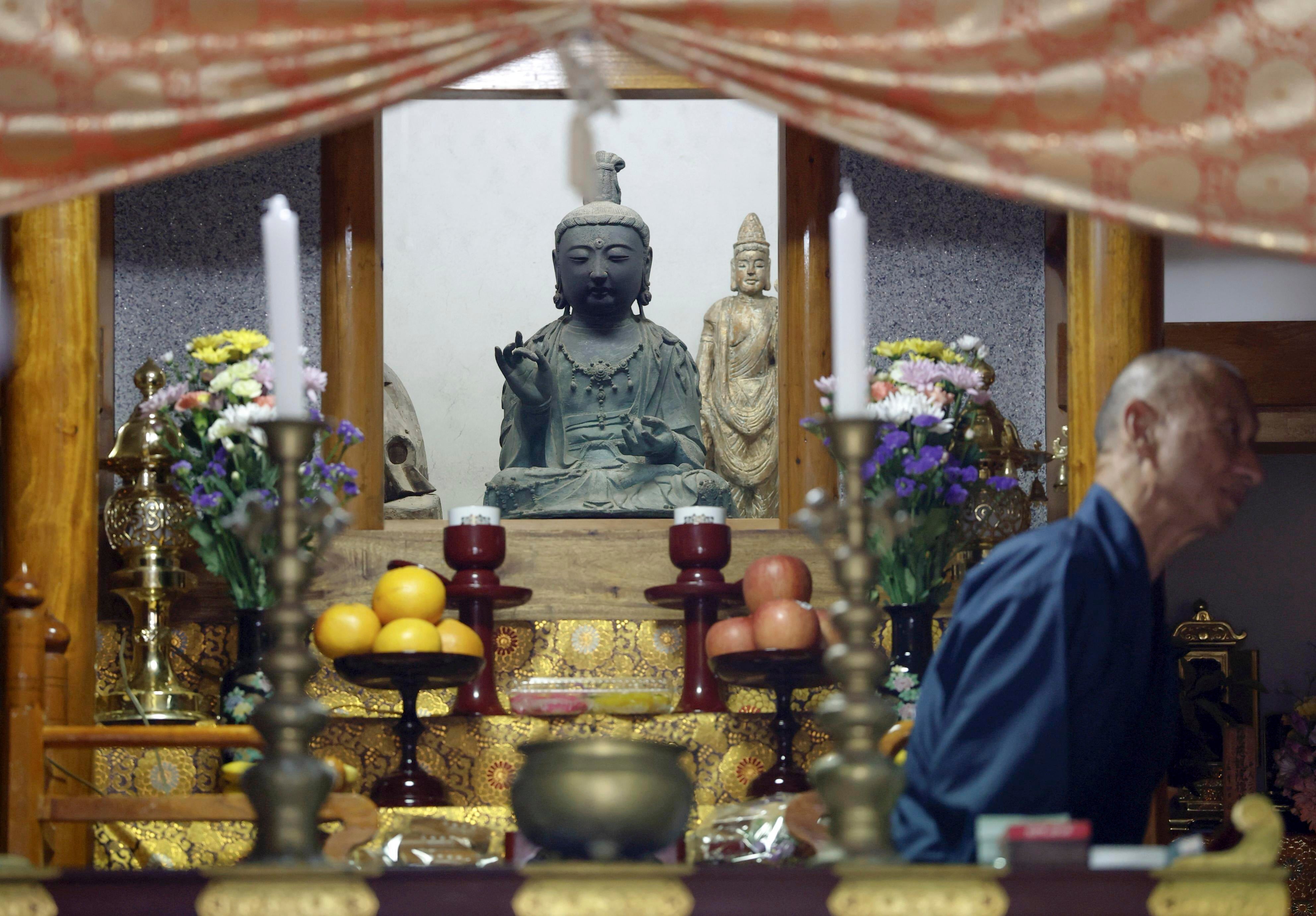 A 14th-century Buddhist statue of the Avalokitesvara Bodhisattva, stolen in October 2012 and taken to South Korea, sits after returned at Kannon Temple on Tsushima Island, southwestern Japan, Monday, May 12, 2025. (Haruna Furuhashi/Kyodo News via AP)