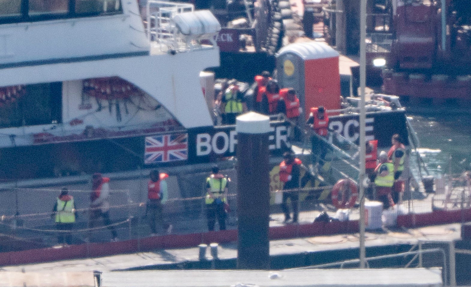 A group of people believed to be migrants are brought in to Dover, Kent, following small boat crossings in the Channel on Monday