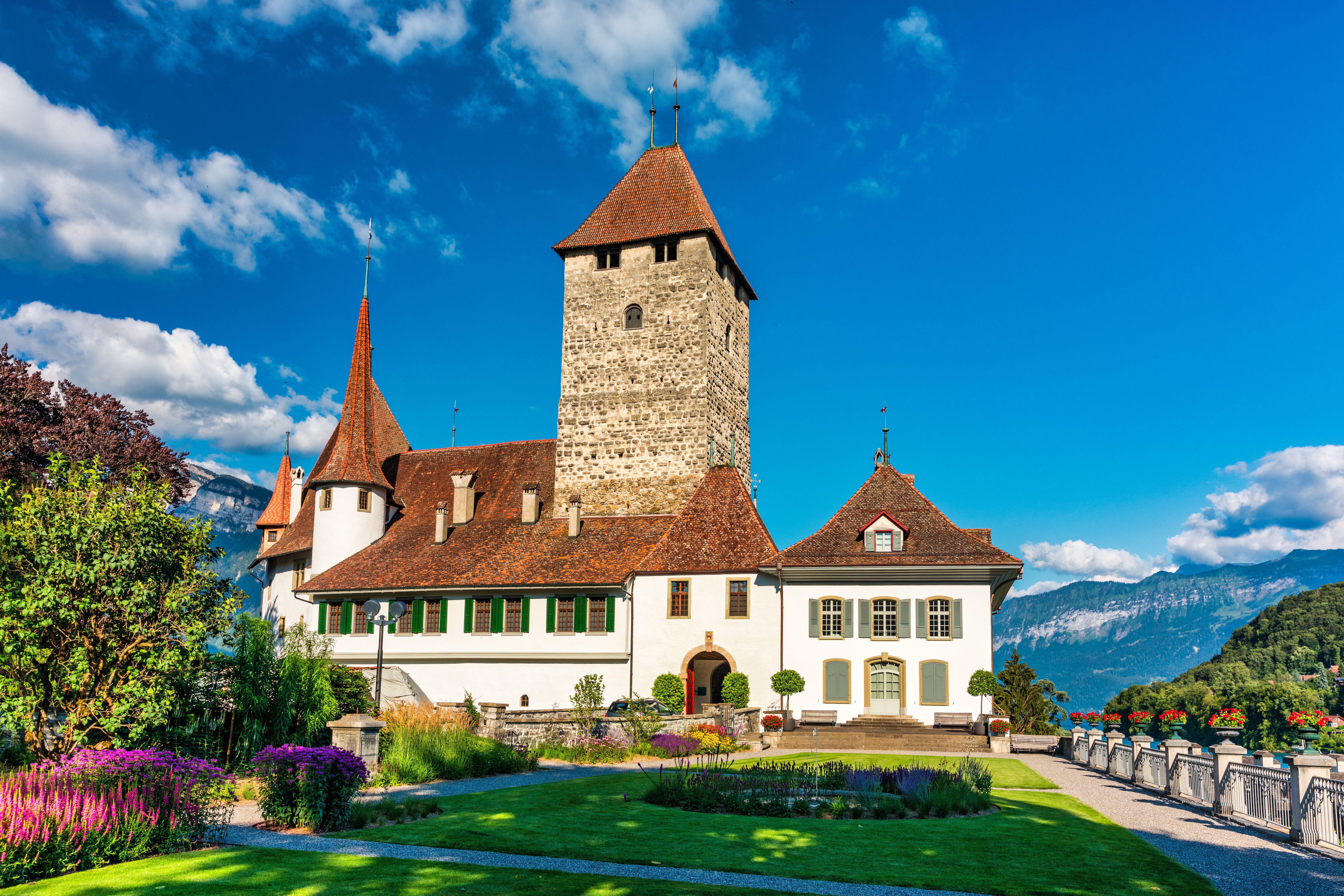 View of Spiez Church and Castle on the shore of Lake Thun (Alamy/PA)