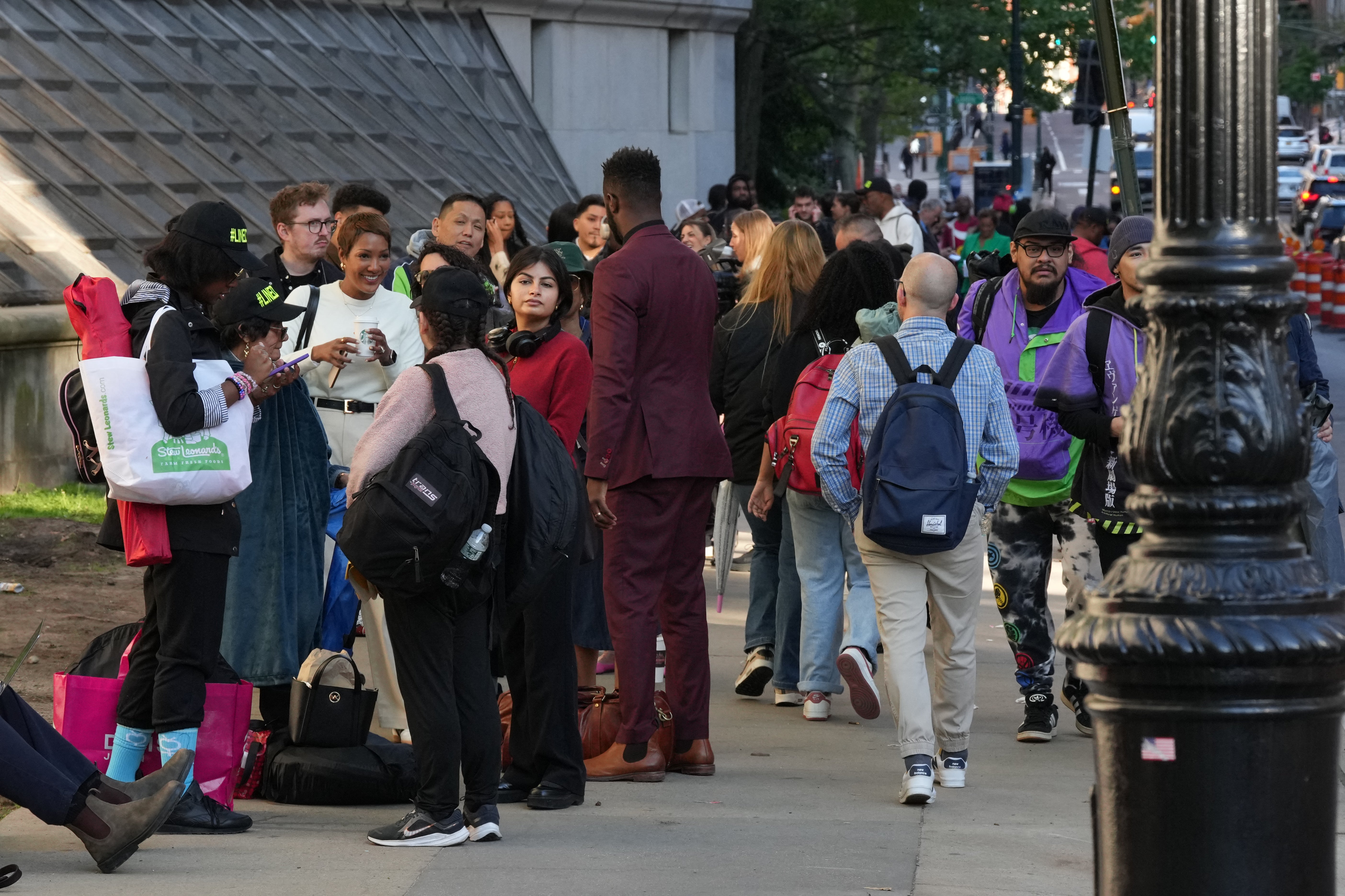 Spectators and members of the media lined up outside of the federal courthouse in Manhattan as early as the night before to attend the first day of trial