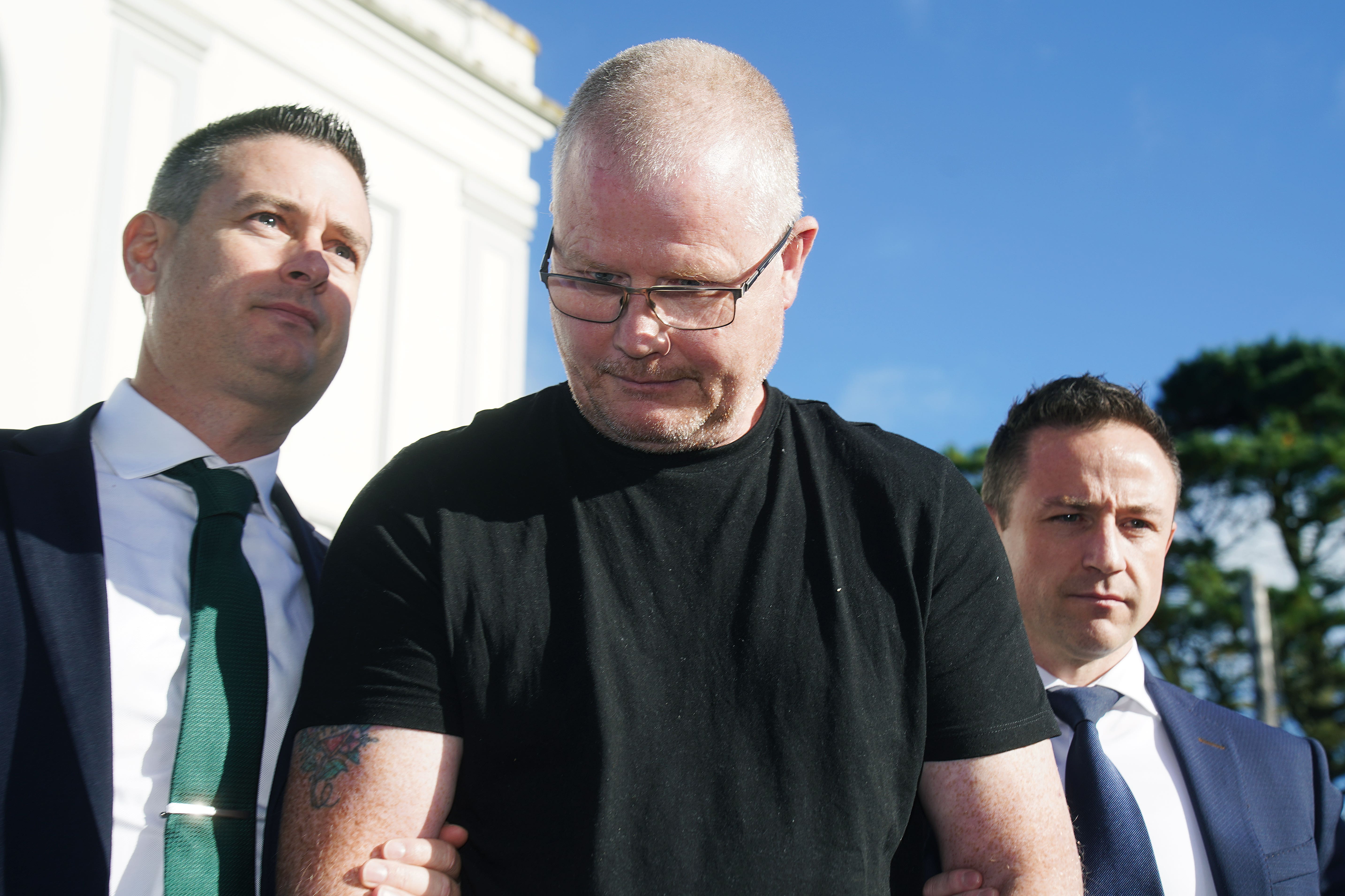 Richard Satchwell (centre) leaving the District Court in Cashel, Co Tipperary, after being charged in connection with the murder of his wife Tina Satchwell