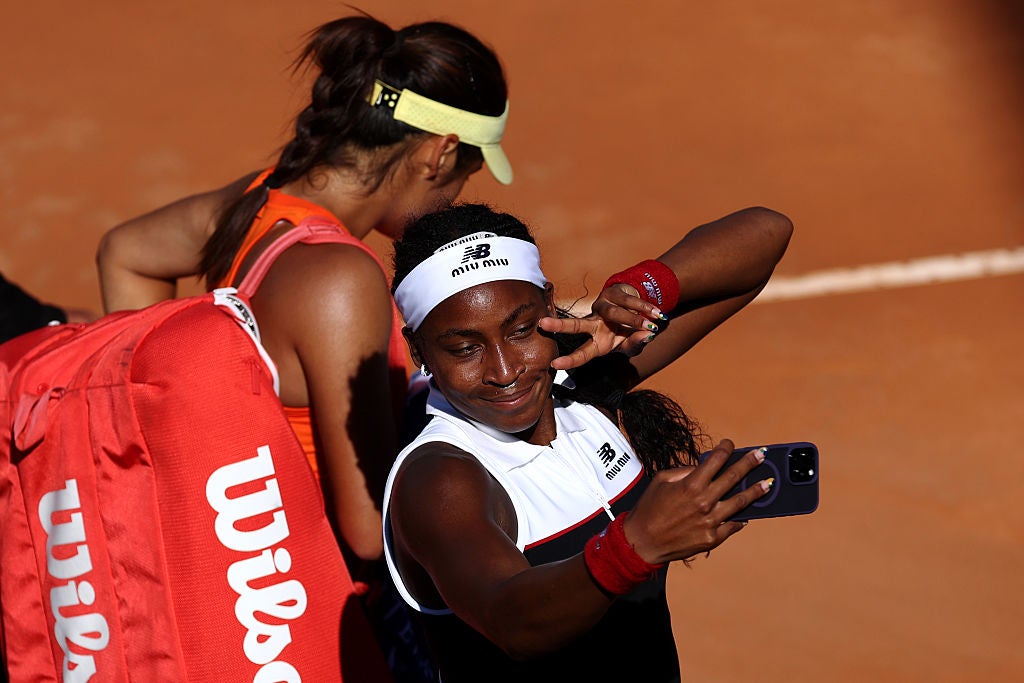 Coco Gauff takes a selfie after defeating Emma Raducanu 6-1 6-2