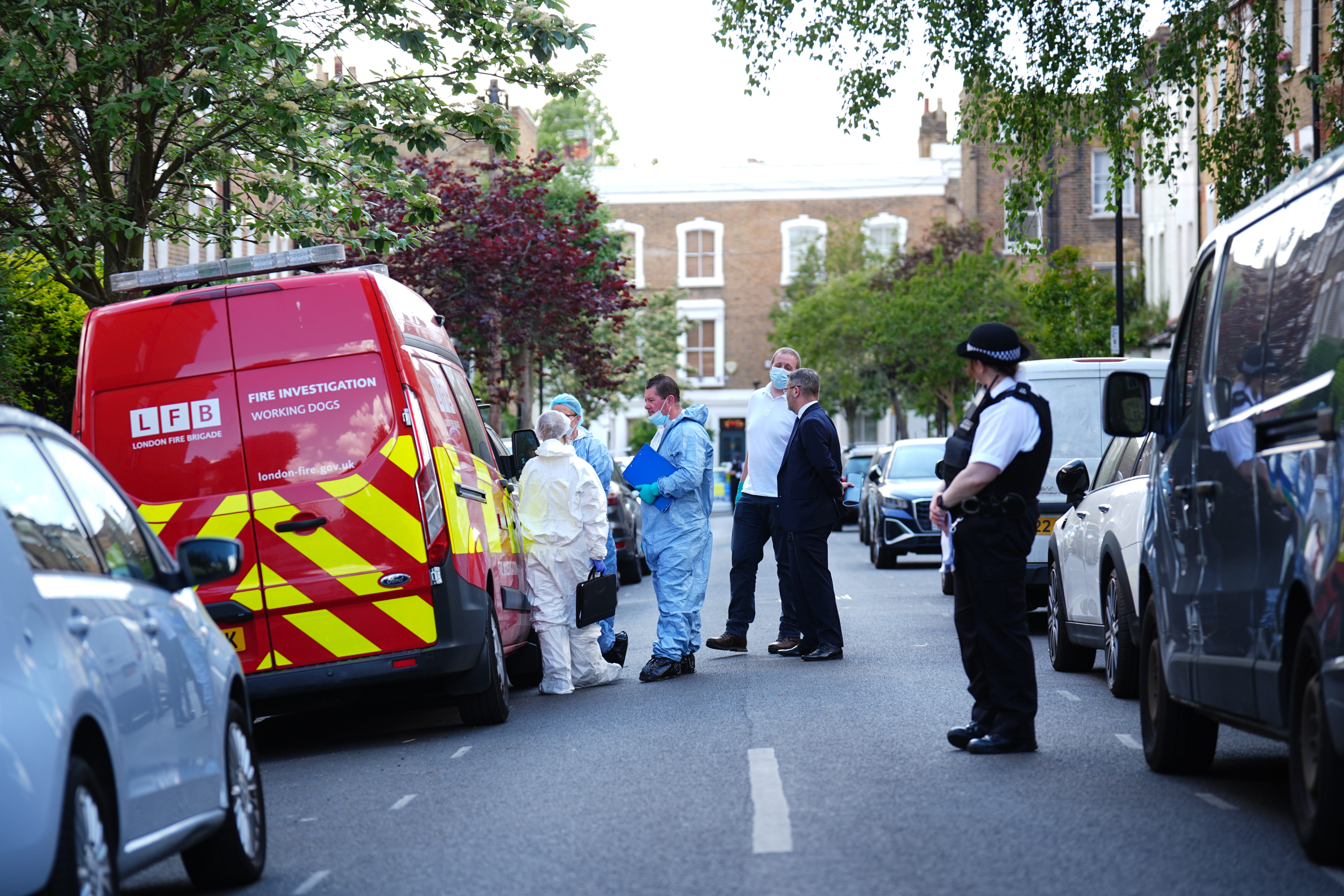 Forensics officers are seen investigating the fire at Sir Keir Starmer’s former home in Kentish Town (James Manning/PA)