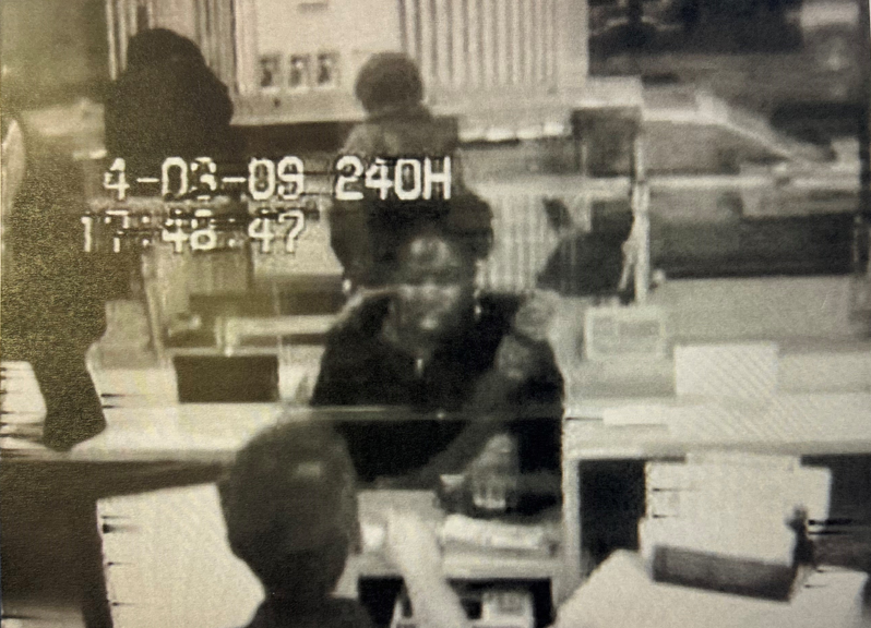 Charline Rosemond is seen in this image taken from surveillance video footage as she withdraws money for a new car before she was murdered in 2009