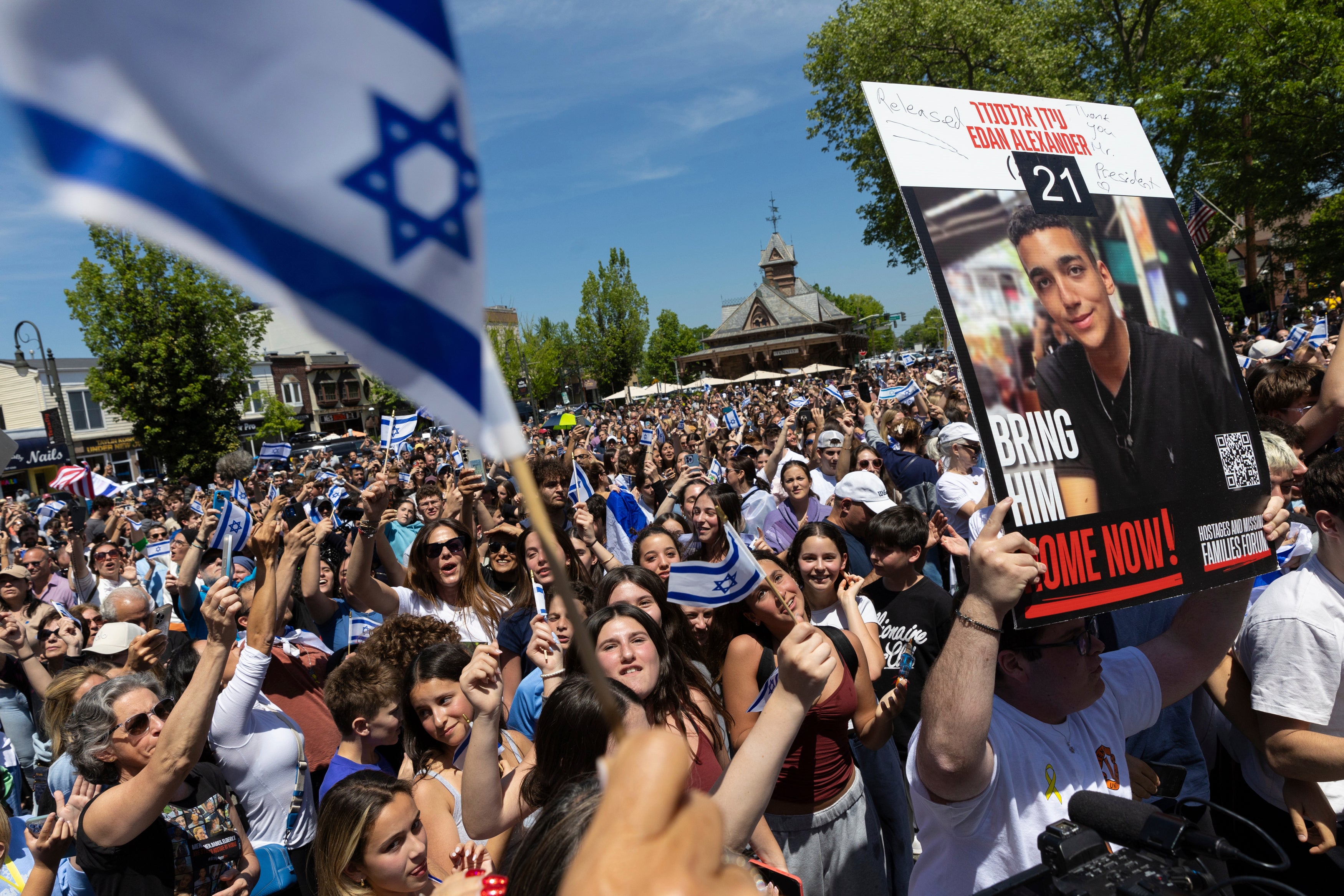People gathered in Huyler Park celebrate the release of American hostage Edan Alexander from Gaza earlier in May