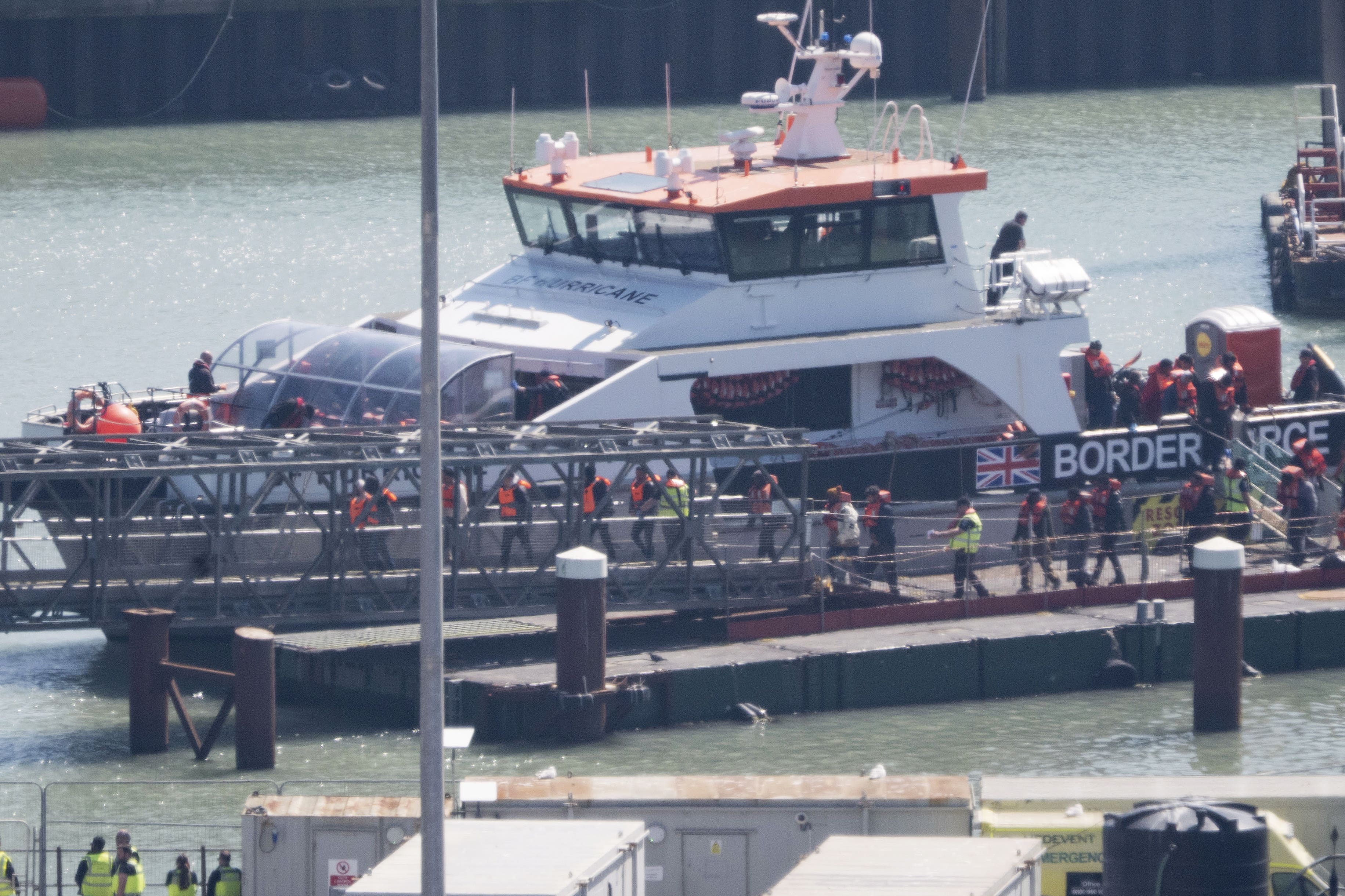 A group of people thought to be migrants are brought in to Dover (Gareth Fuller/PA)