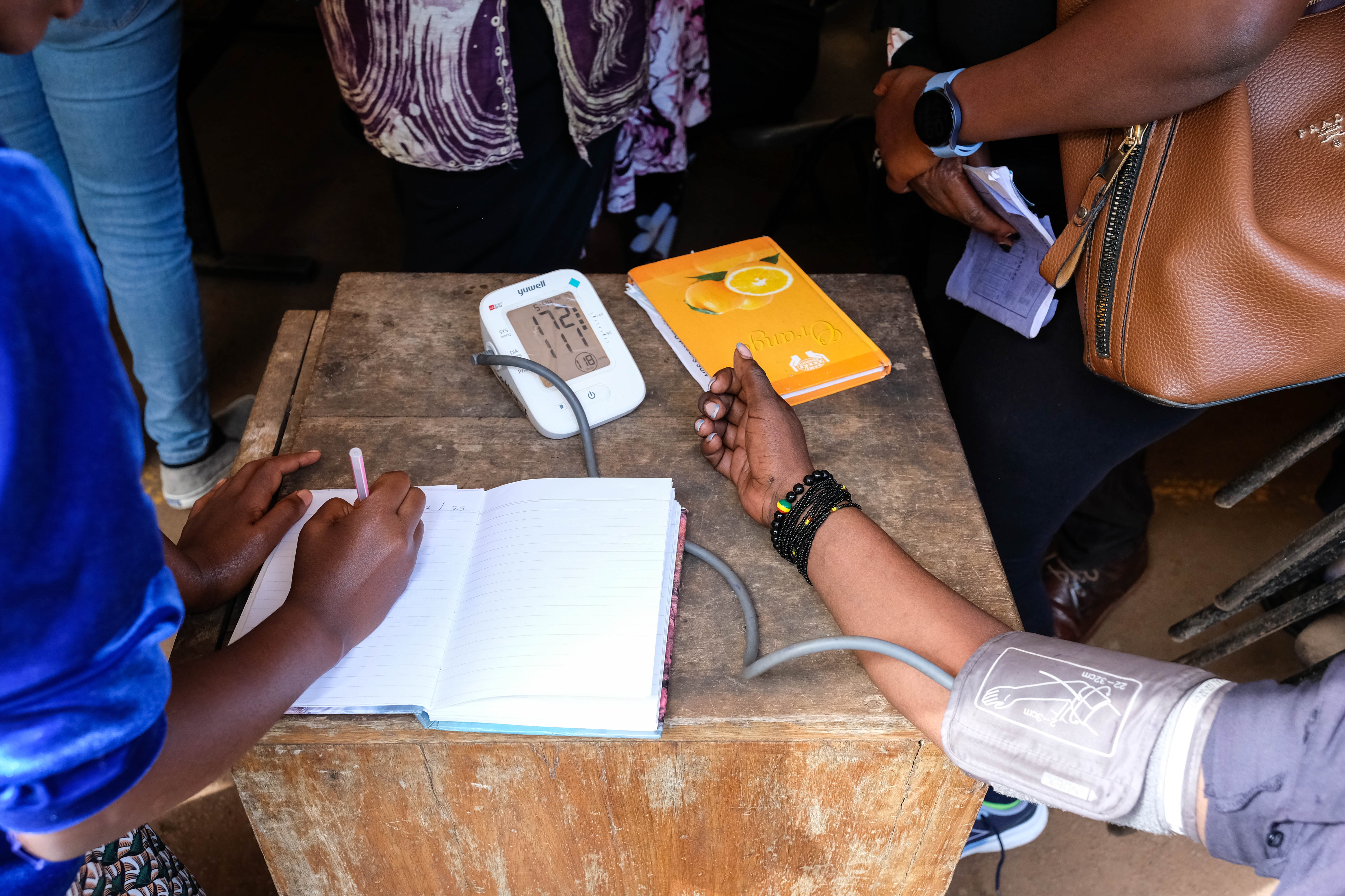 Medical team takes patient's blood pressure