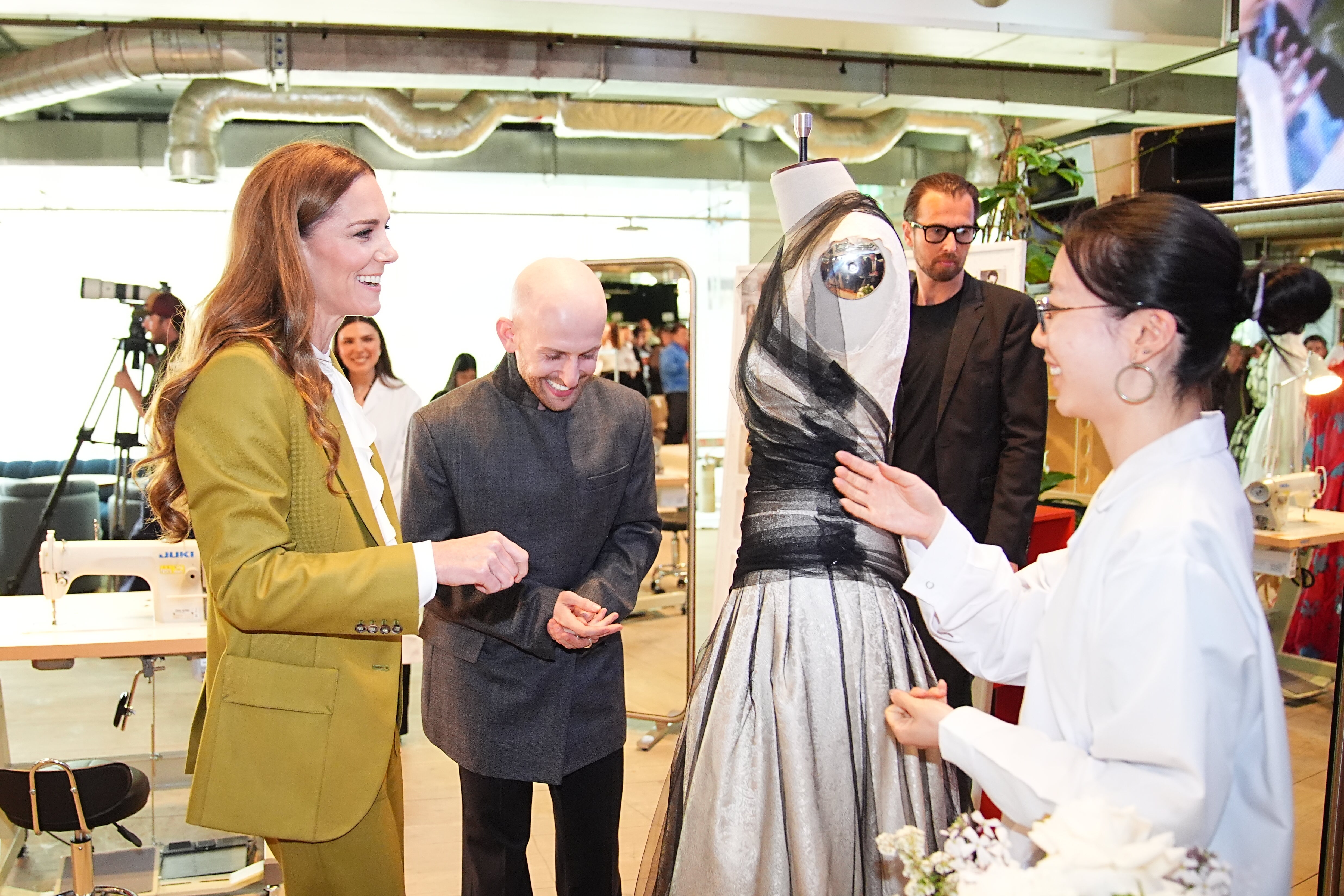 Kate with McDowell as the duo look over his work