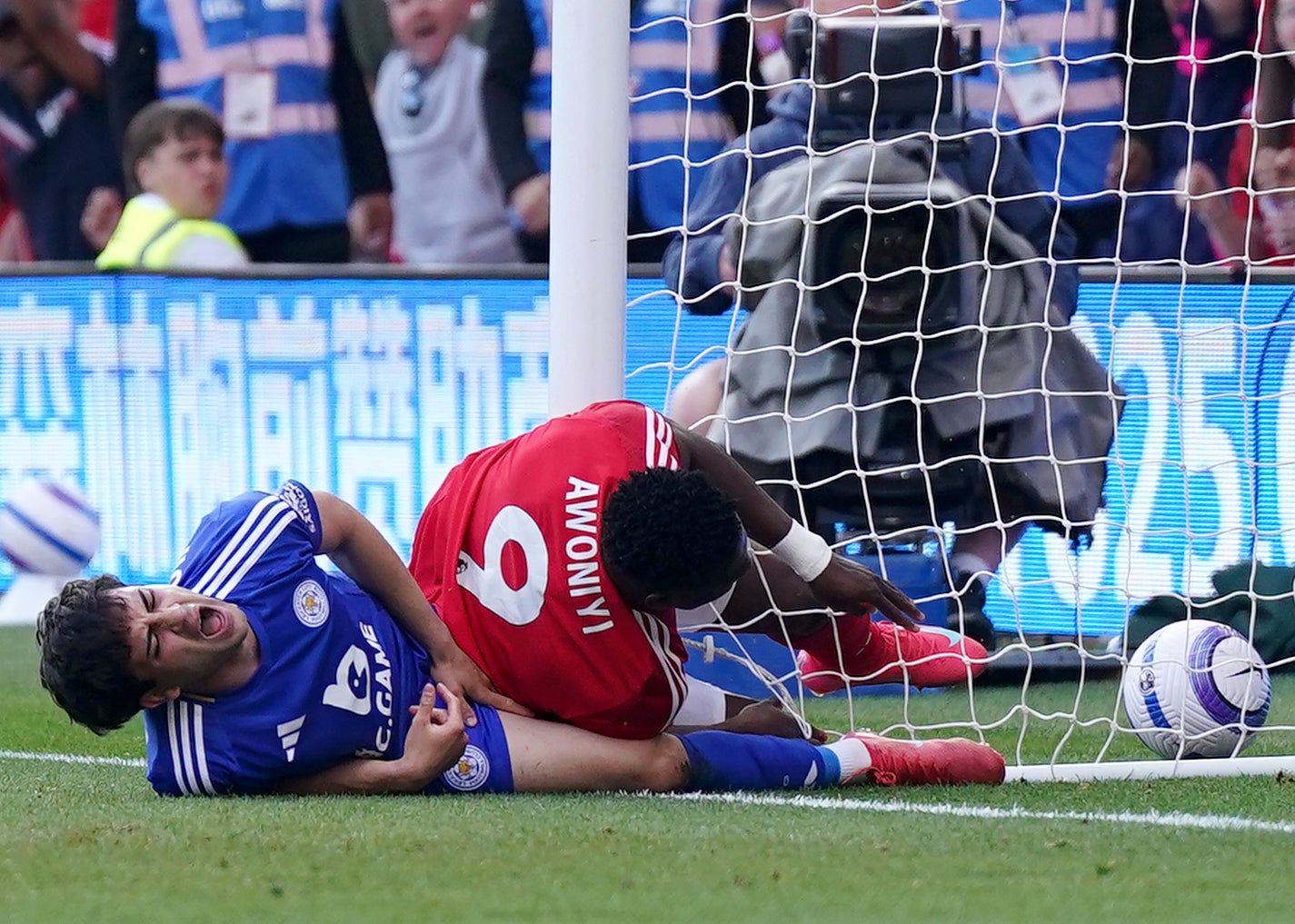 Awoniyi, right, crashed into the post after play had been allowed to continue