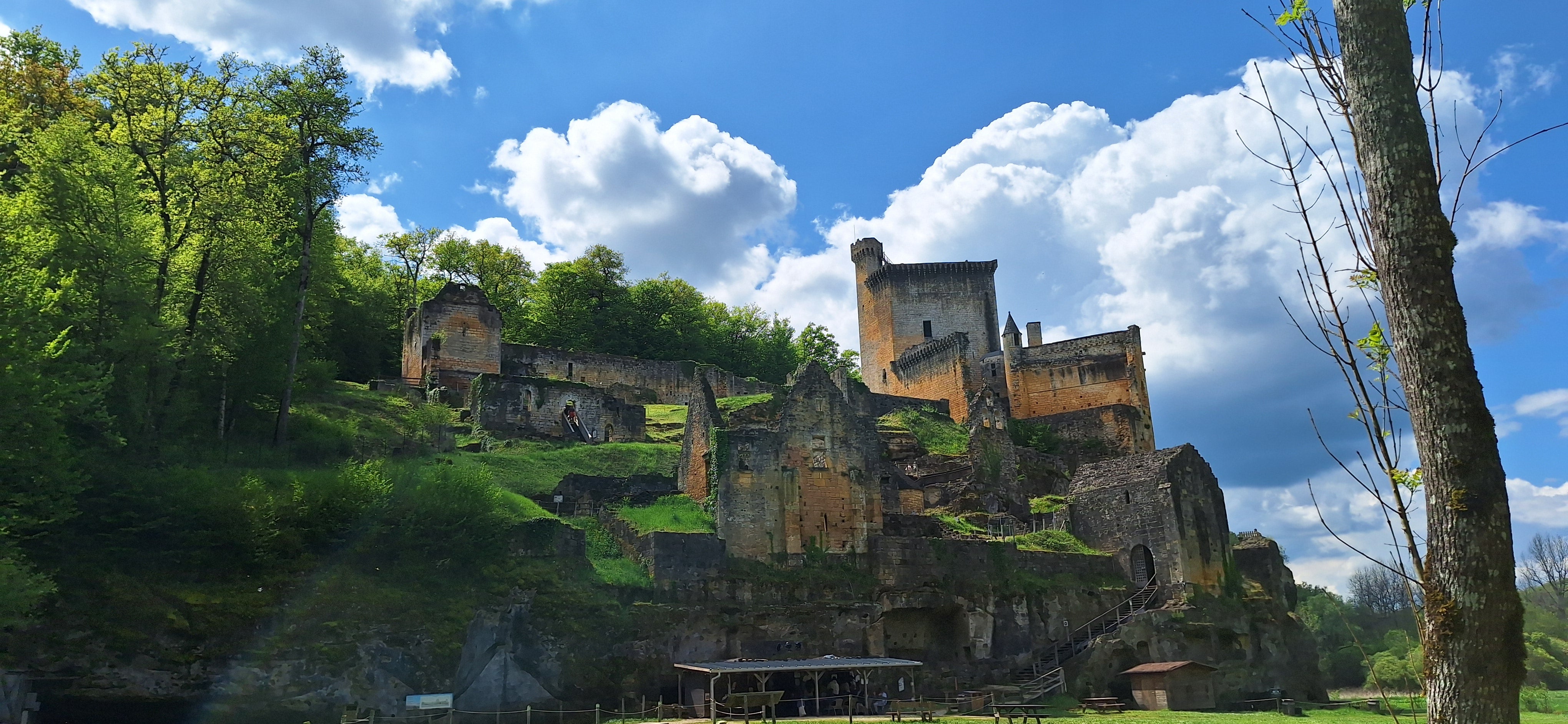 Château de Commarque stands sentinel on a green embankment