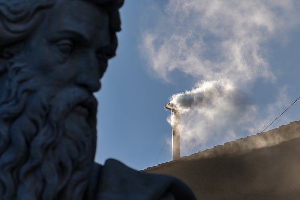 White smoke rises from the chimney on the roof of the Sistine Chapel indicating that the College of Cardinals have elected a new Pope during their fourth vote on the second day of their secret conclave on May 8, 2025 in Vatican City, Vatican.