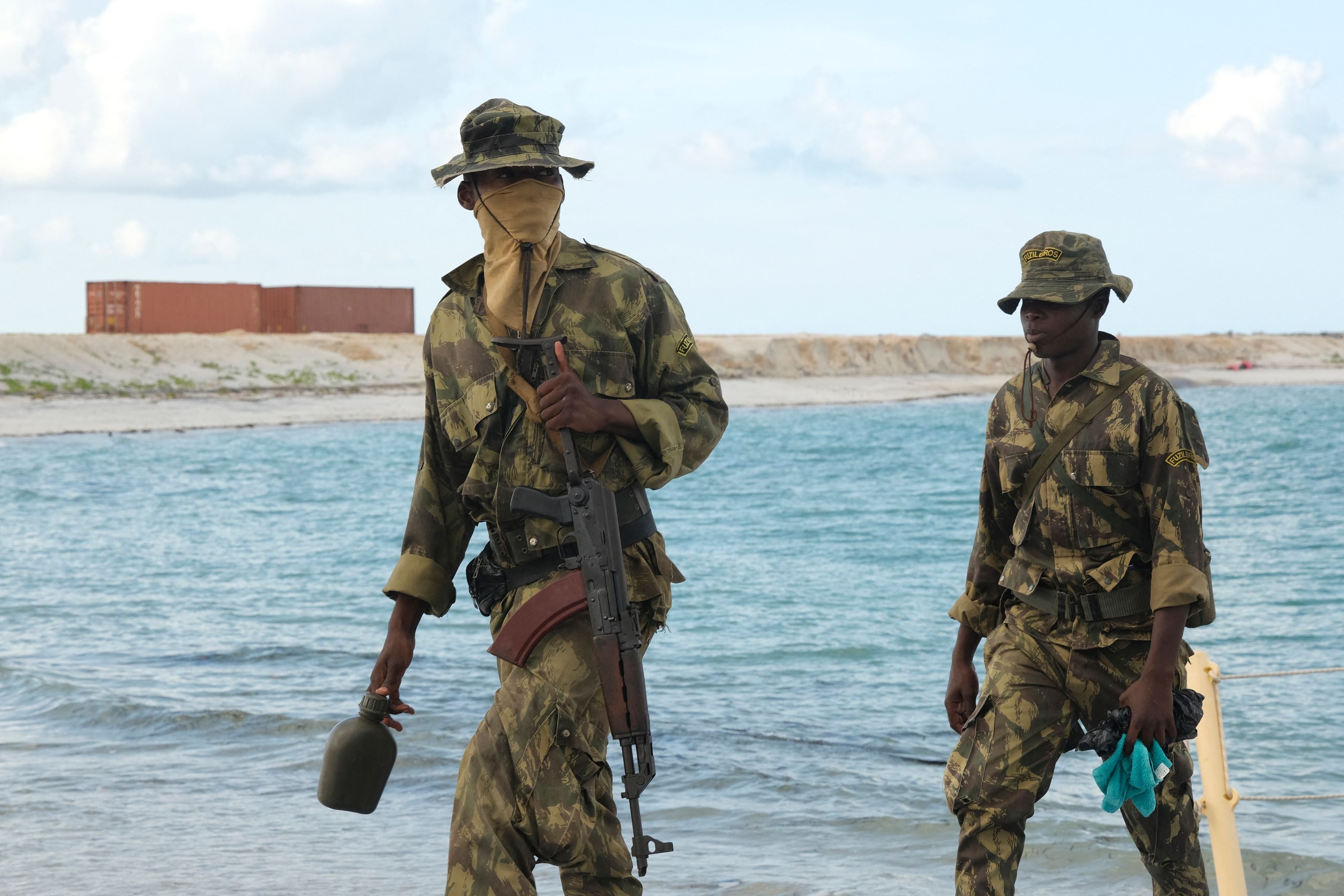 Mozambican marines are seen guarding the docks of the LNG plant