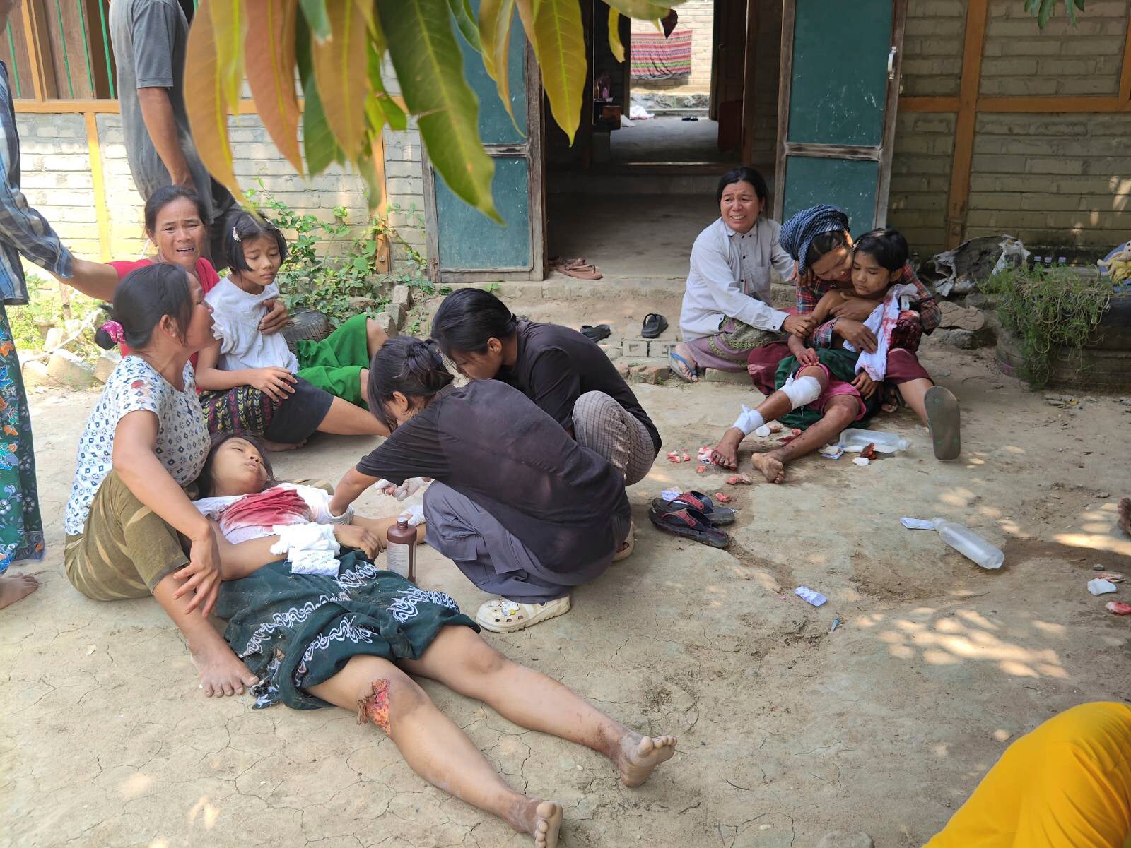 Medics treat injured students after an airstrike by the Myanmar army struck a school at Ohe Htein Twin village in Tabayin township on 12 May 2025