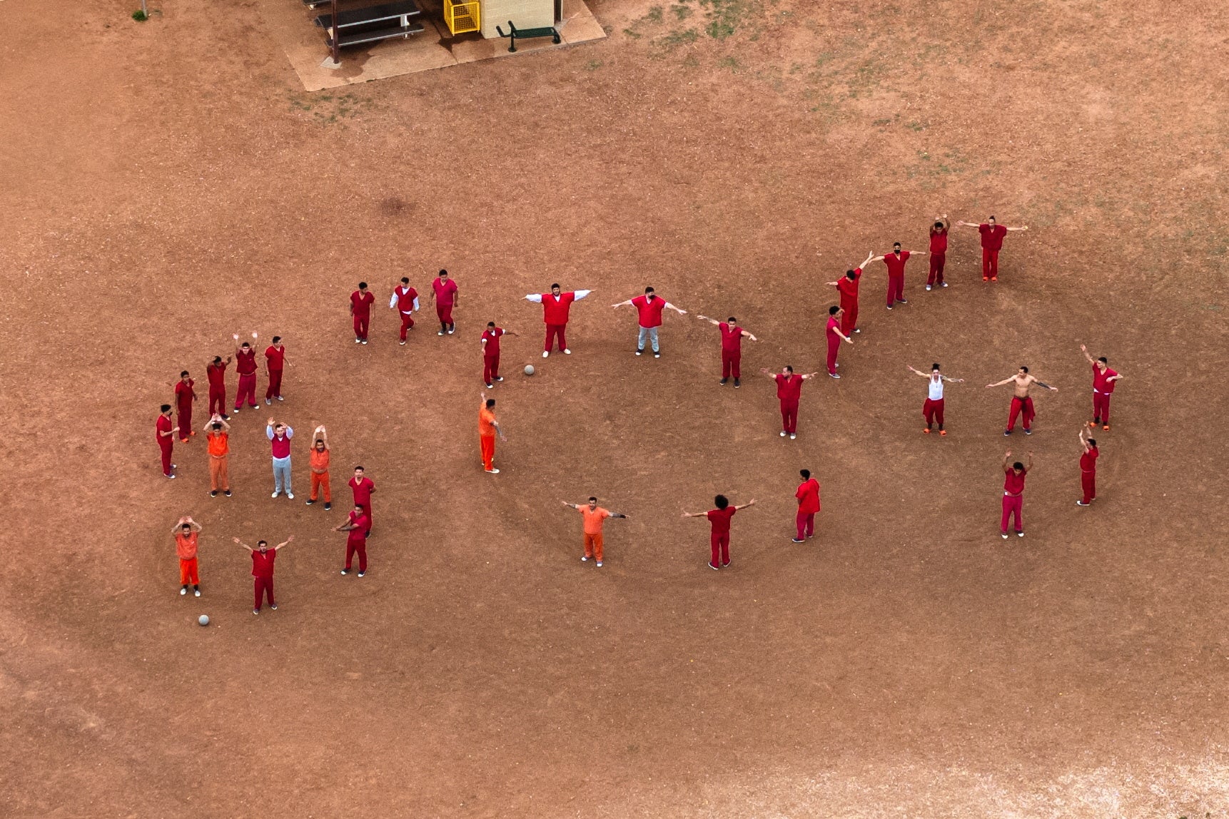 A drone view of detainees at the Bluebonnet Detention Facility form the letters SOS on April 28