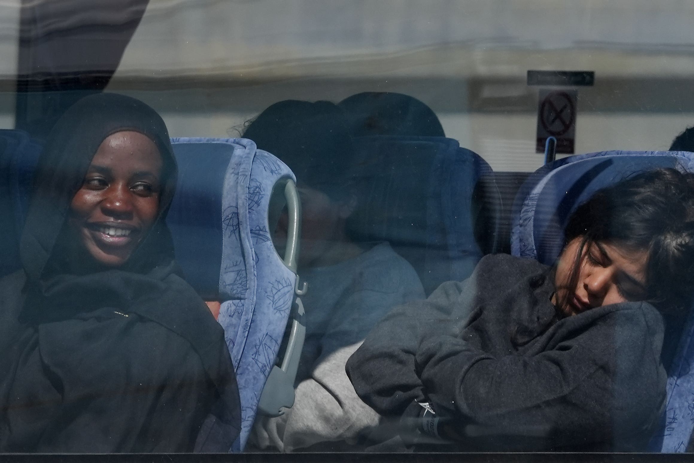 People believed to be migrants leaving by bus in Dover, Kent, following small boat crossings in the Channel (Gareth Fuller/PA)