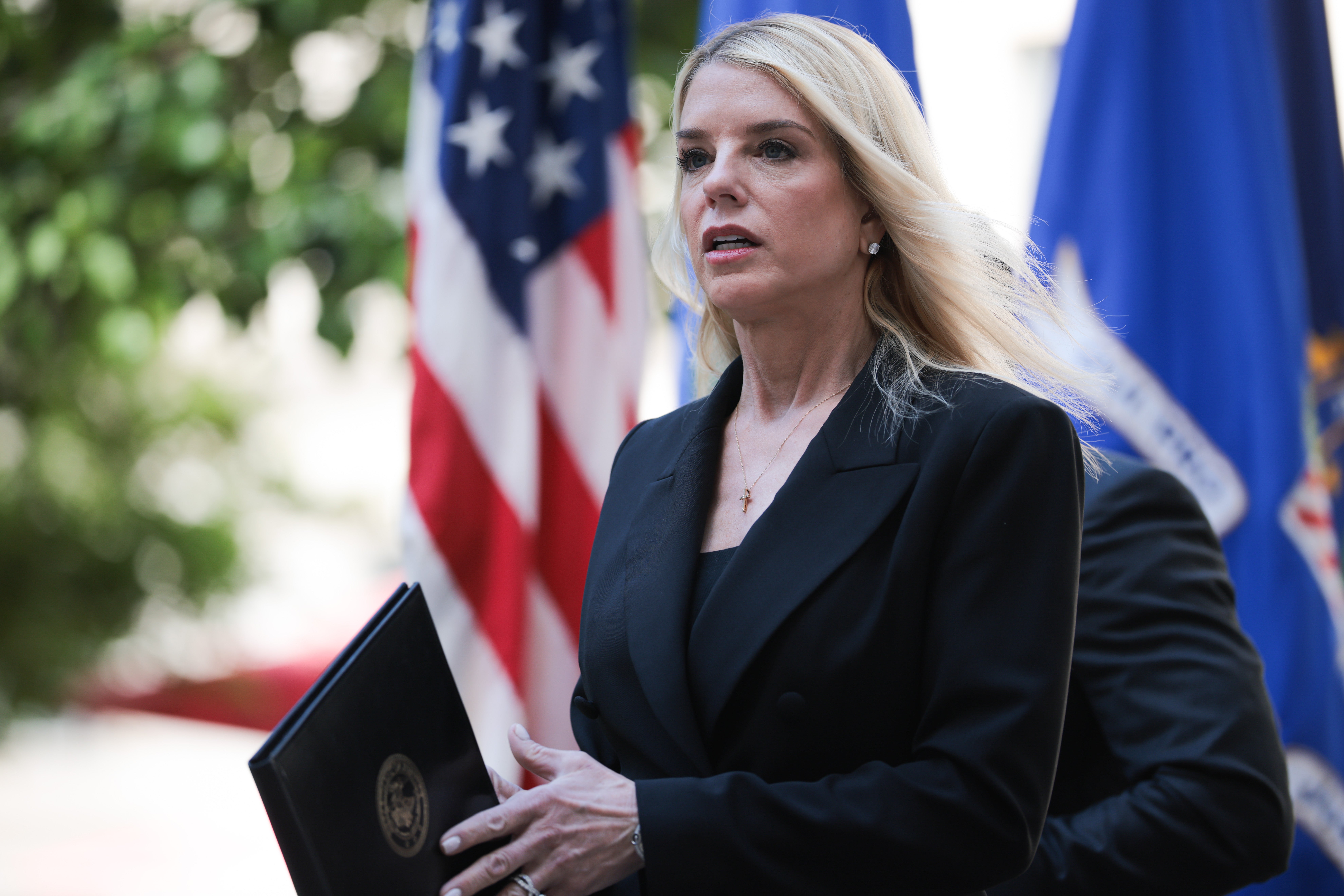 U.S. Attorney General Pam Bondi exits a press conference to announce the results of Operation Restore Justice