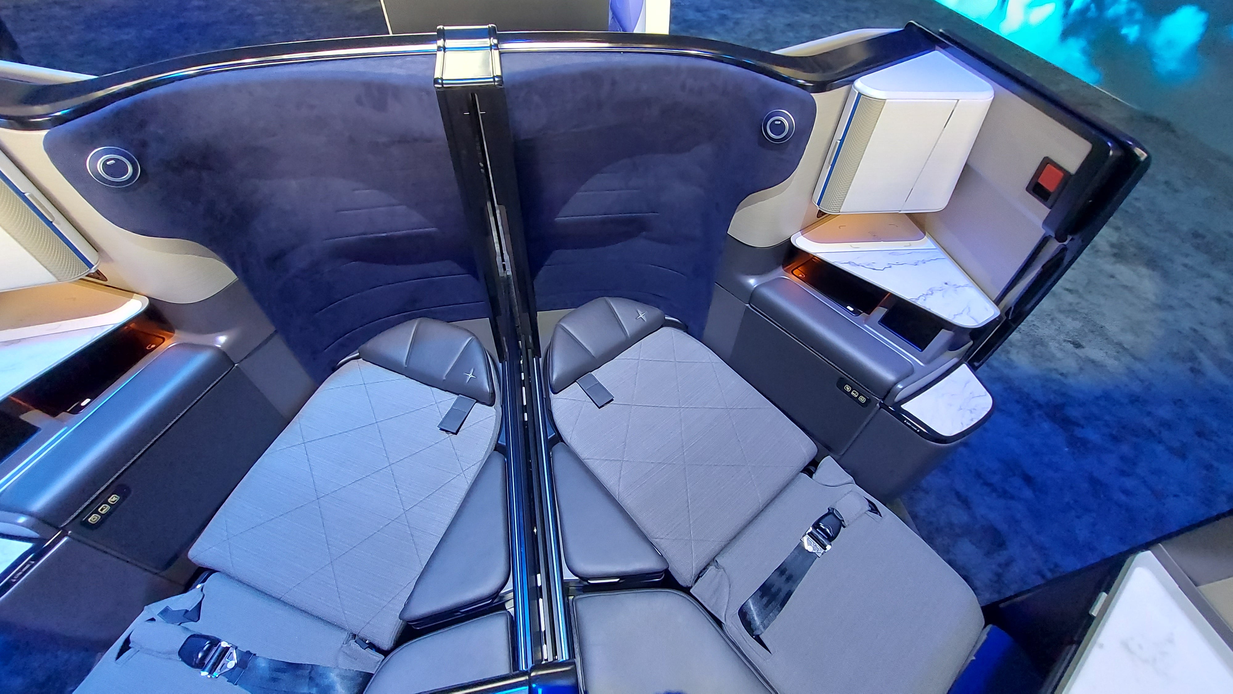 The middle two Polaris Studio seats become a double bed when the divider is lowered and a mattress topper fitted
