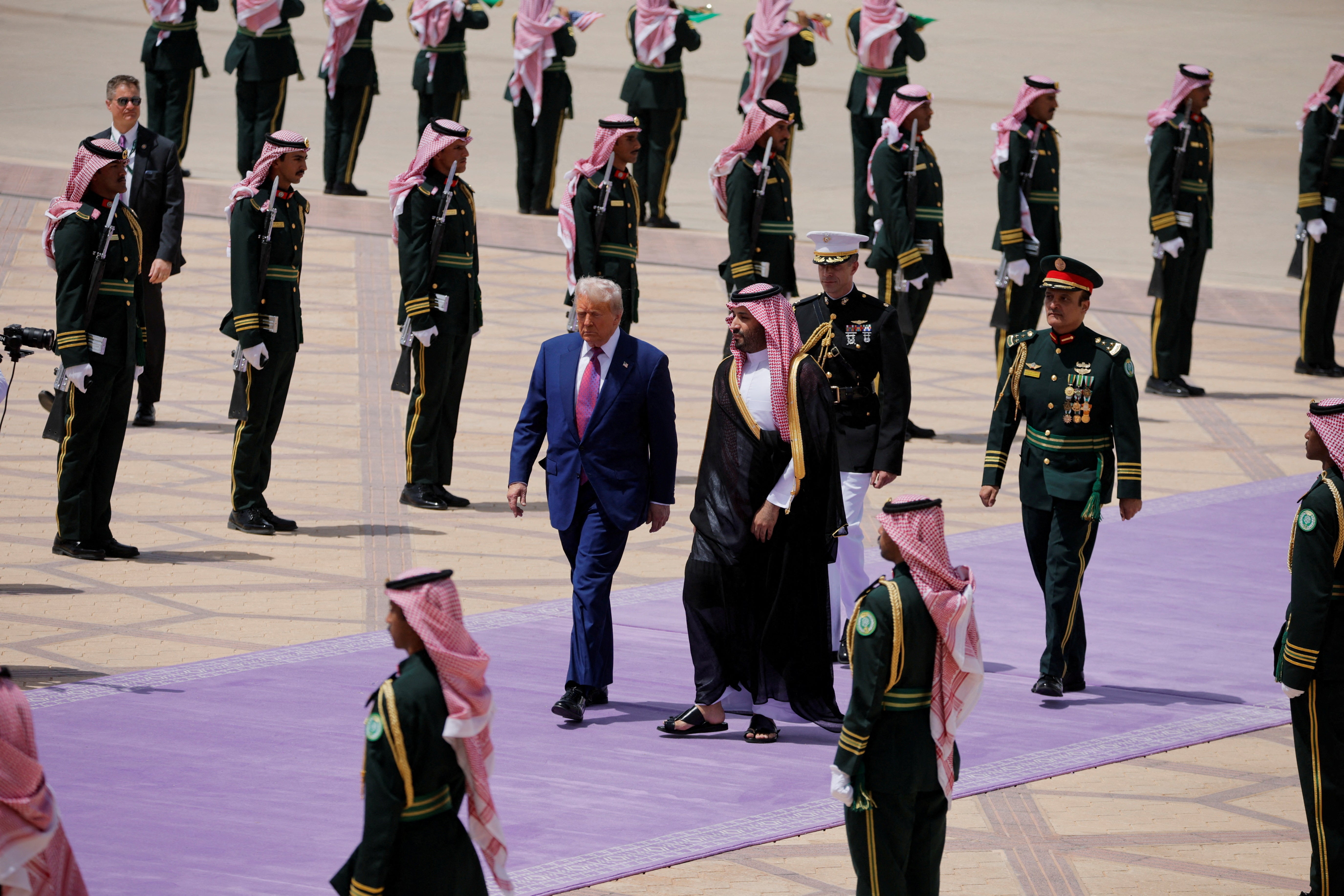 U.S. President Donald Trump and Saudi Crown Prince Mohammed Bin Salman walk as he arrives at King Khalid International Airport in Riyadh