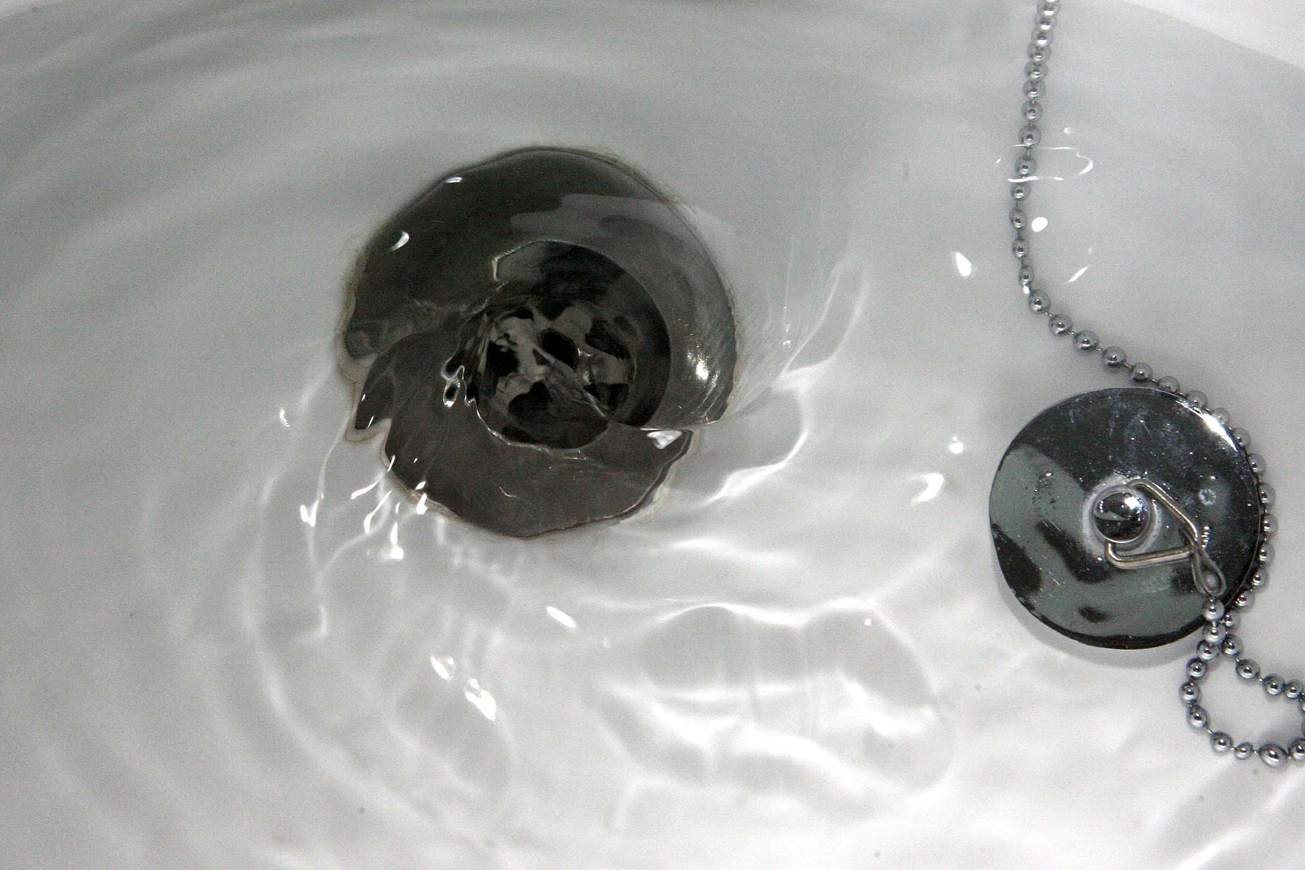 A general view of water going down a plughole.