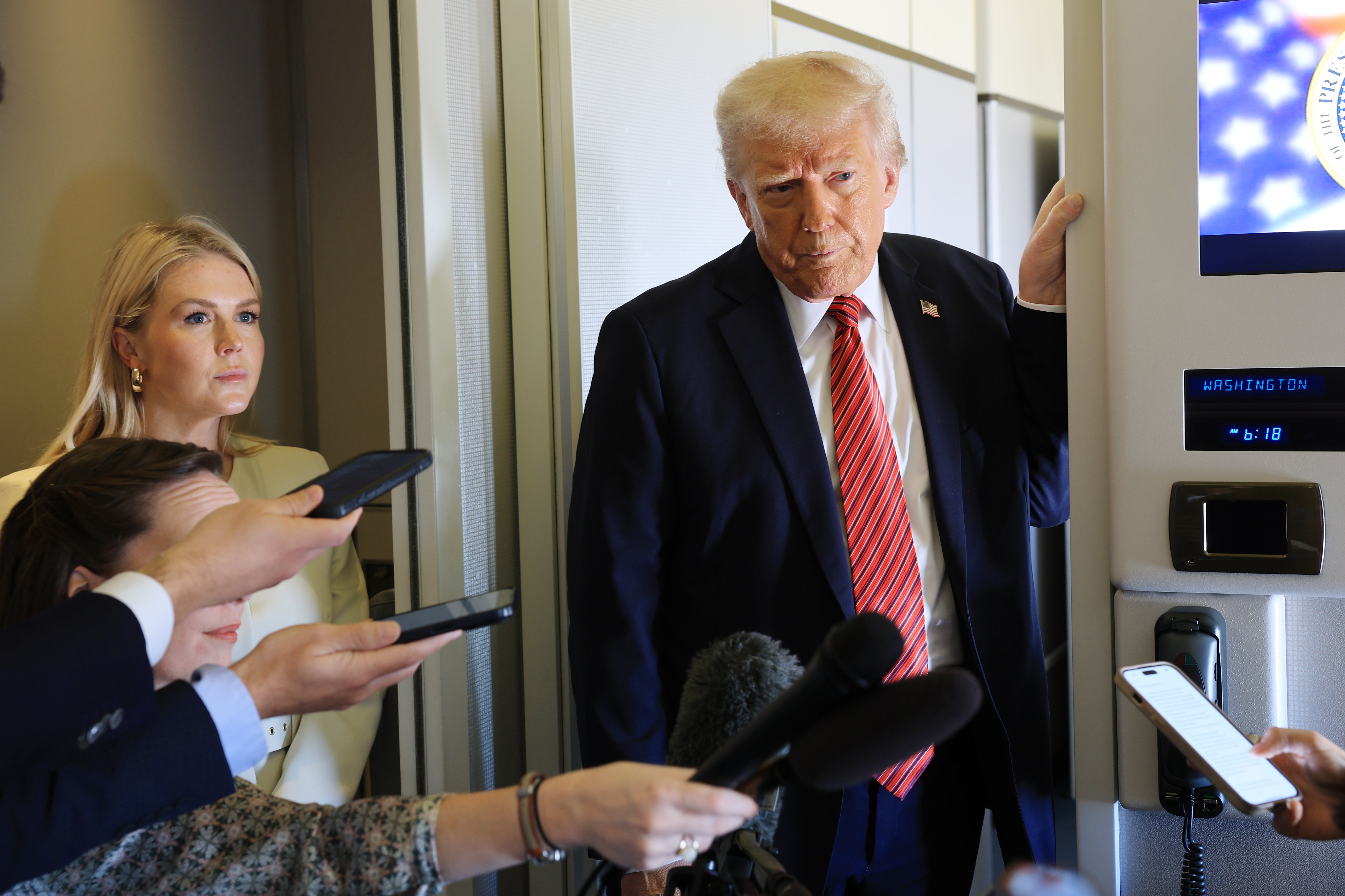 Trump talks to the press aboard Air Force One en route to Doha, Qatar, on Wednesday May 14 2025