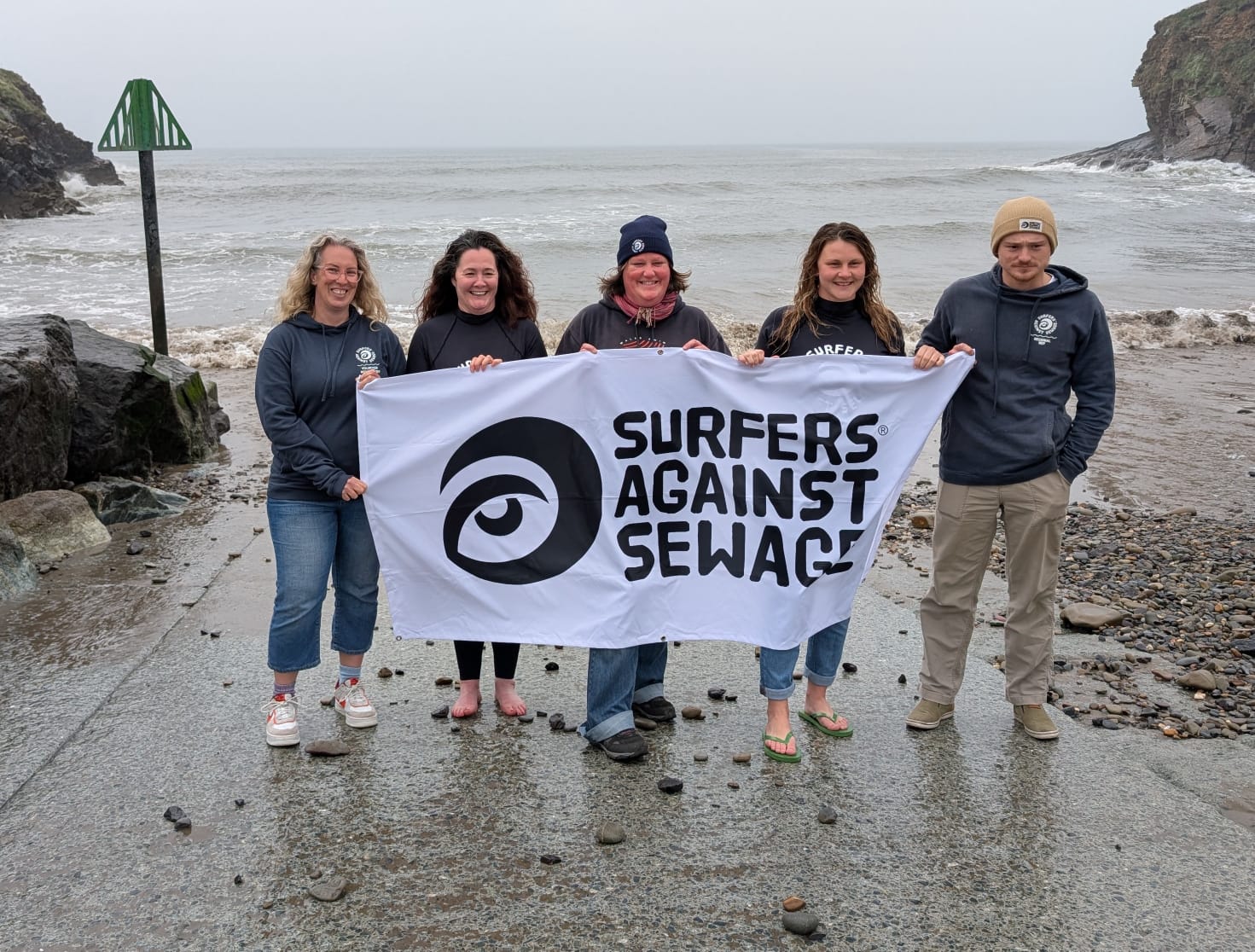 Kate Jones, centre, has become unwell twice from swimming in the sea and now campaigns for Surfers Against Sewage