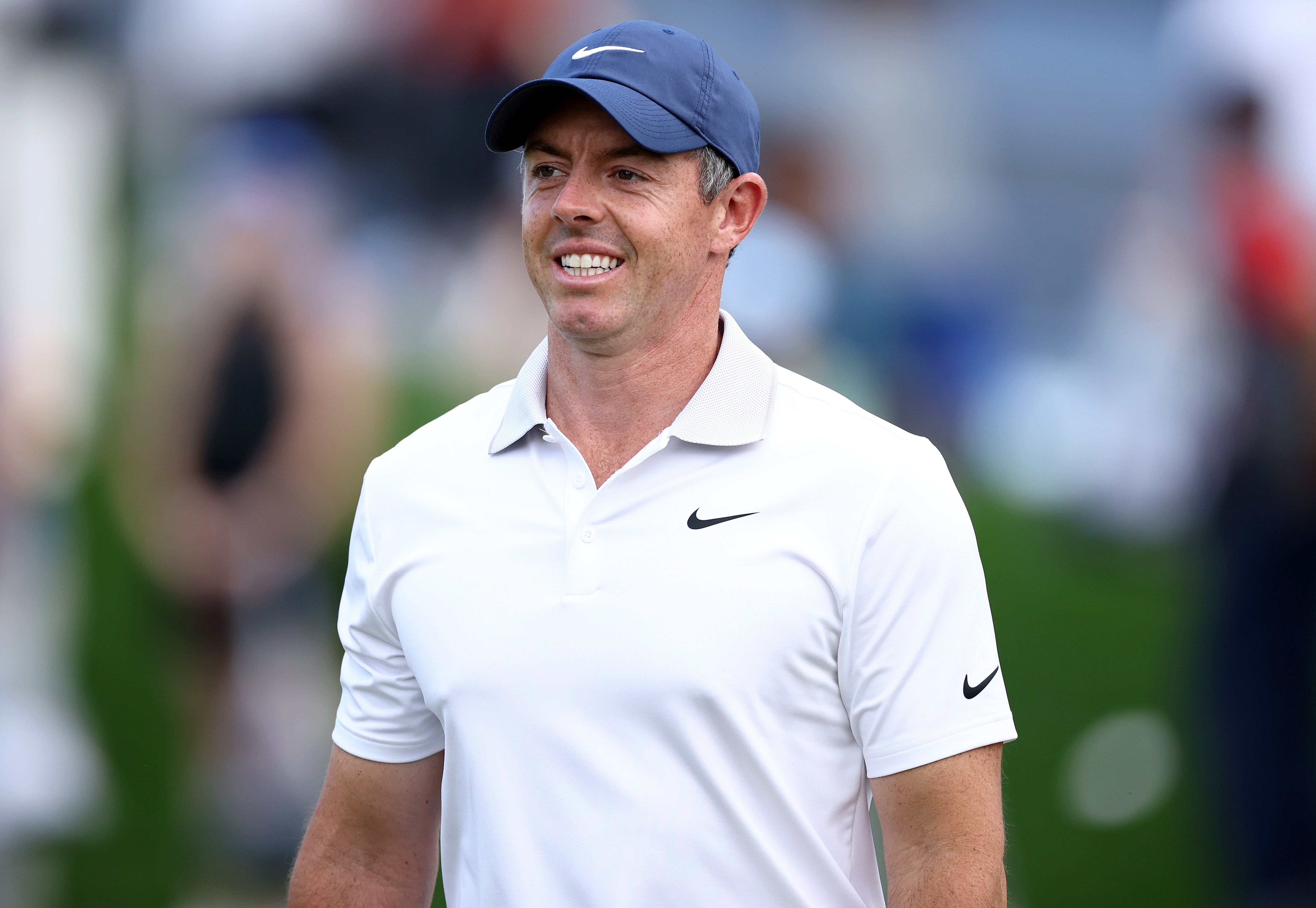 Rory McIlroy of Northern Ireland walks on the first green before the PGA Championship at Quail Hollow