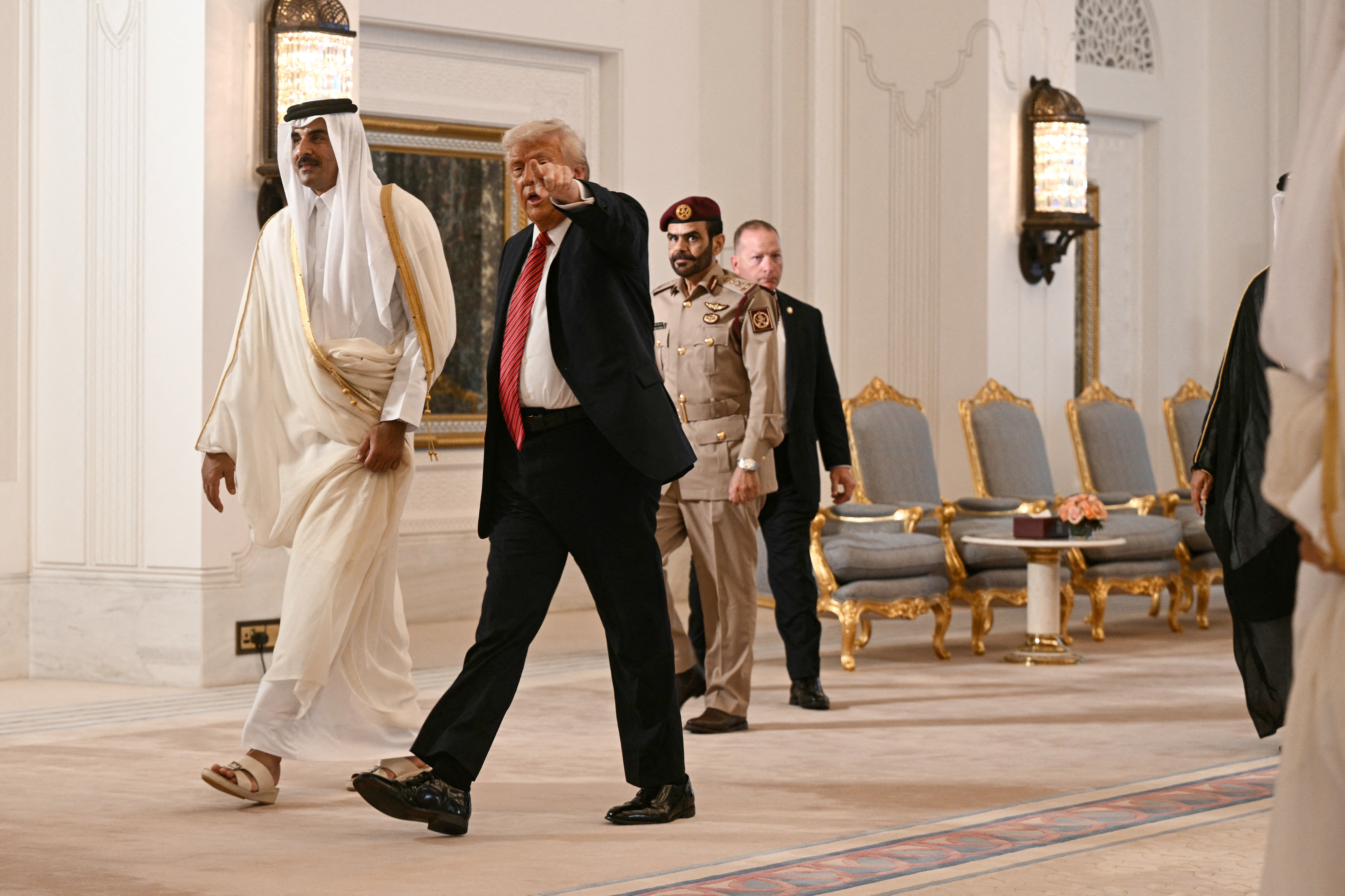 Qatar’s Emir Sheikh Tamim bin Hamad al-Thani and US president Donald Trump arrive at a signing ceremony at the Royal Palace in Doha