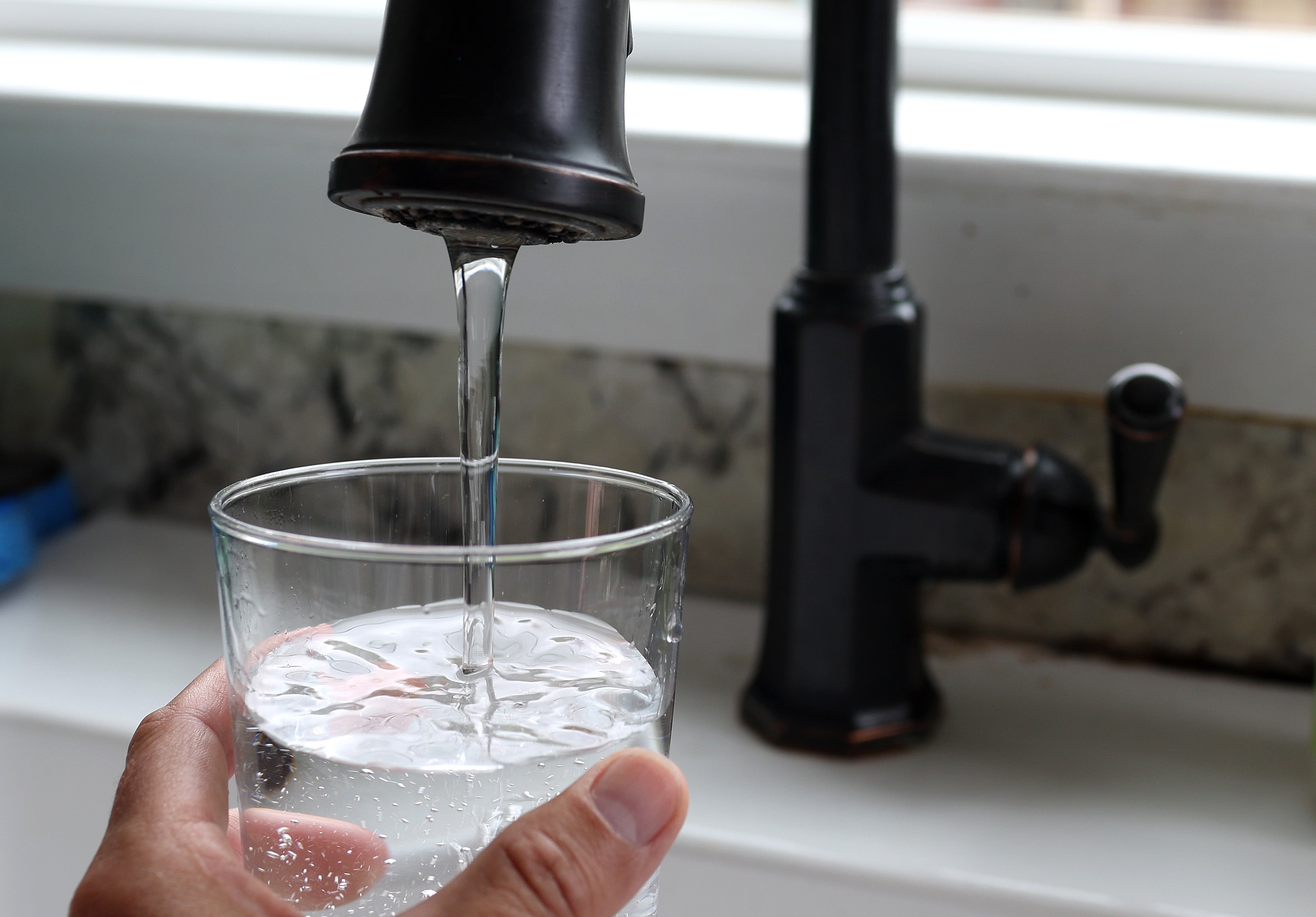 Is drinking tap water bad for you? Wellness influencers say yes, but here’s what the experts think