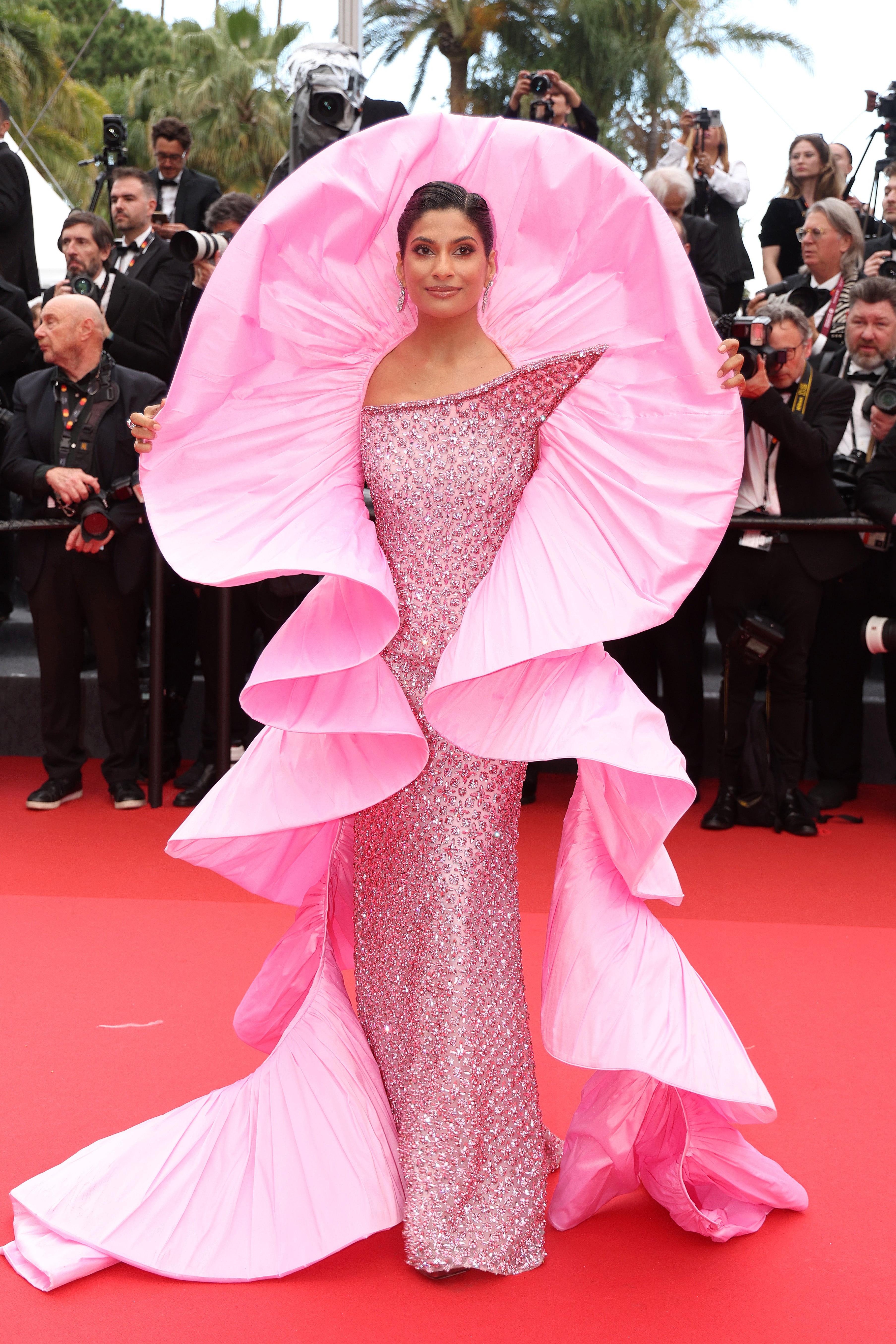 TV Personality Farhana Bodi celebrated the premiere of ‘Partir Un Jour’ in a pink sculpture-esque gown with a pointed collar