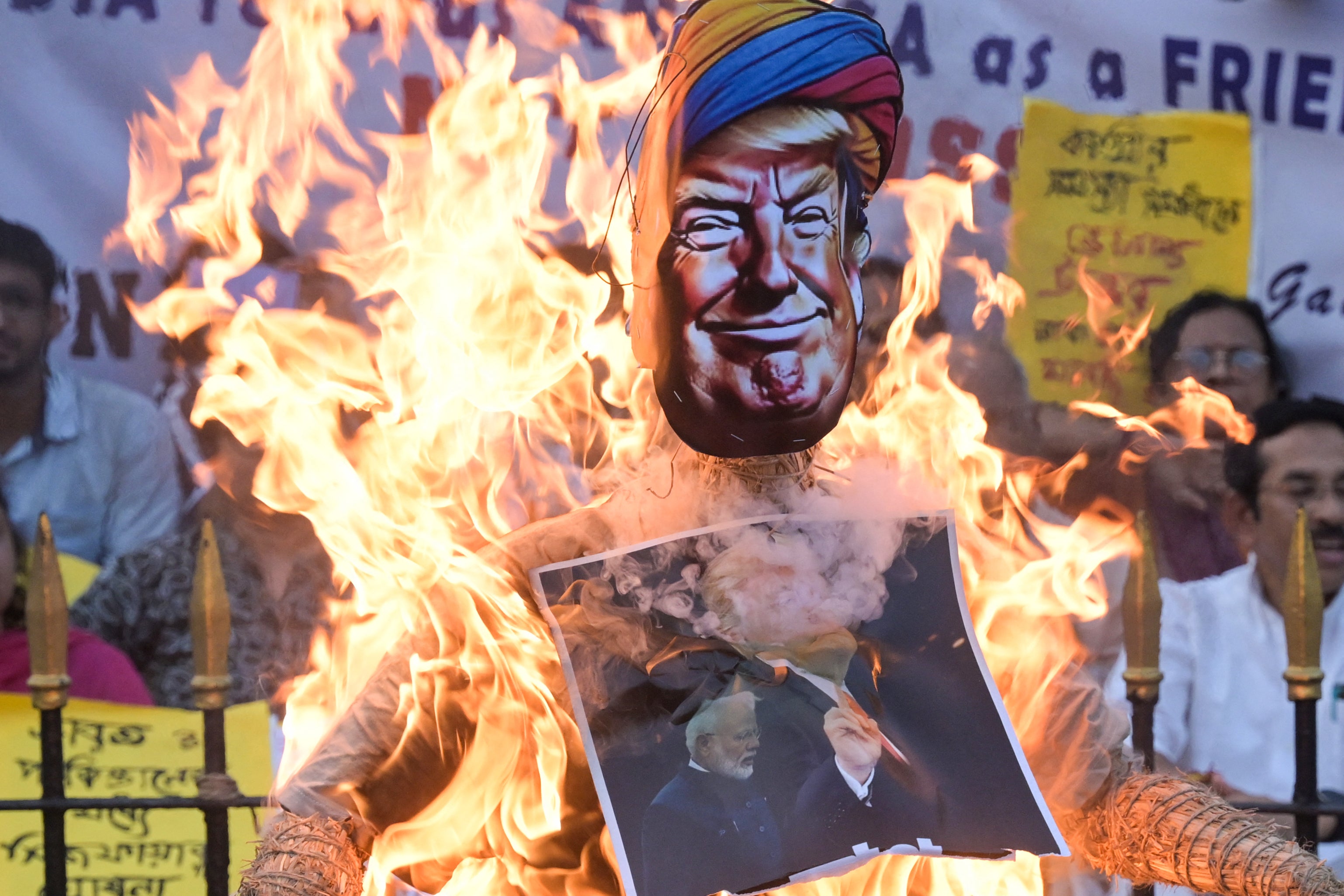 Supporters of India's opposition Congress party burn an effigy of US president Donald Trump for what they claim to be his interference in conflict with Pakistan during a protest in Kolkata on 14 May 2025