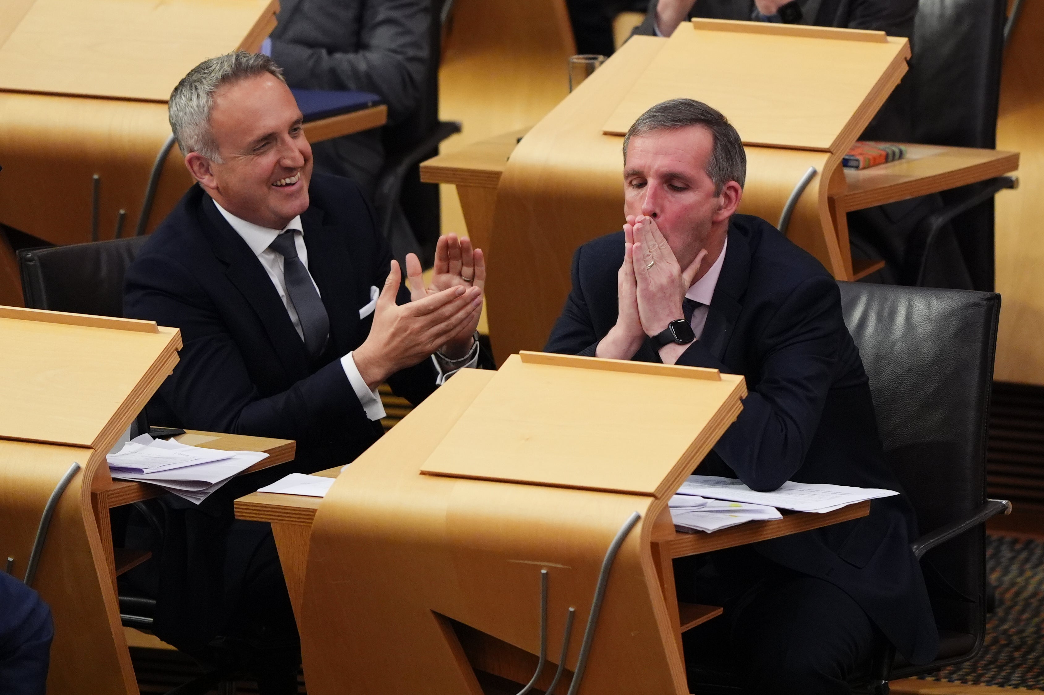 Liberal Democrat MSP Liam McArthur (right) after his bill on assisted dying was backed in principle at the Scottish parliament on Tuesday