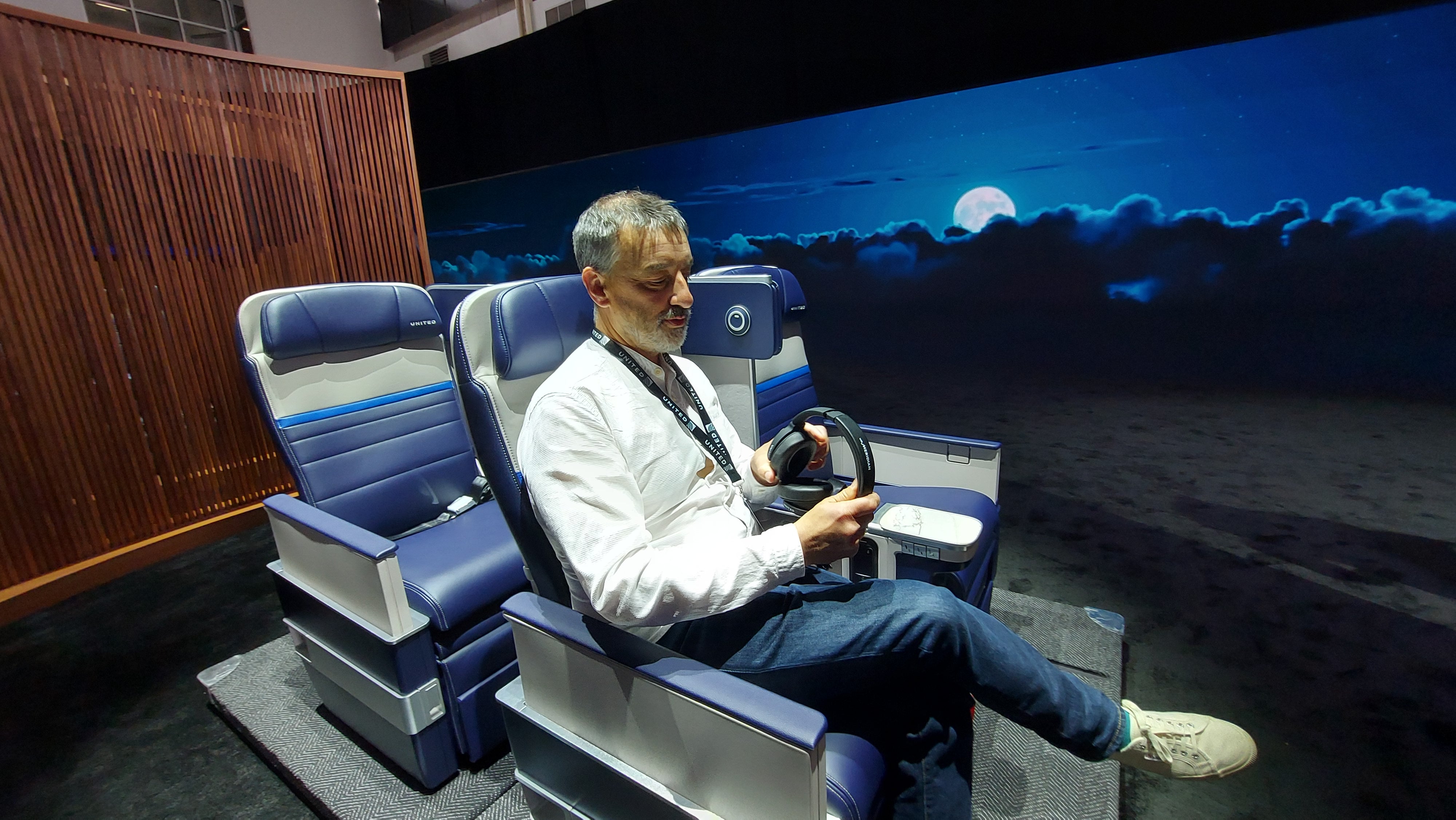 Ted puts the new premium economy seat to the test. It features new privacy dividers and 16-inch screens, but legroom remains the same — seat pitch is unchanged at 38 inches