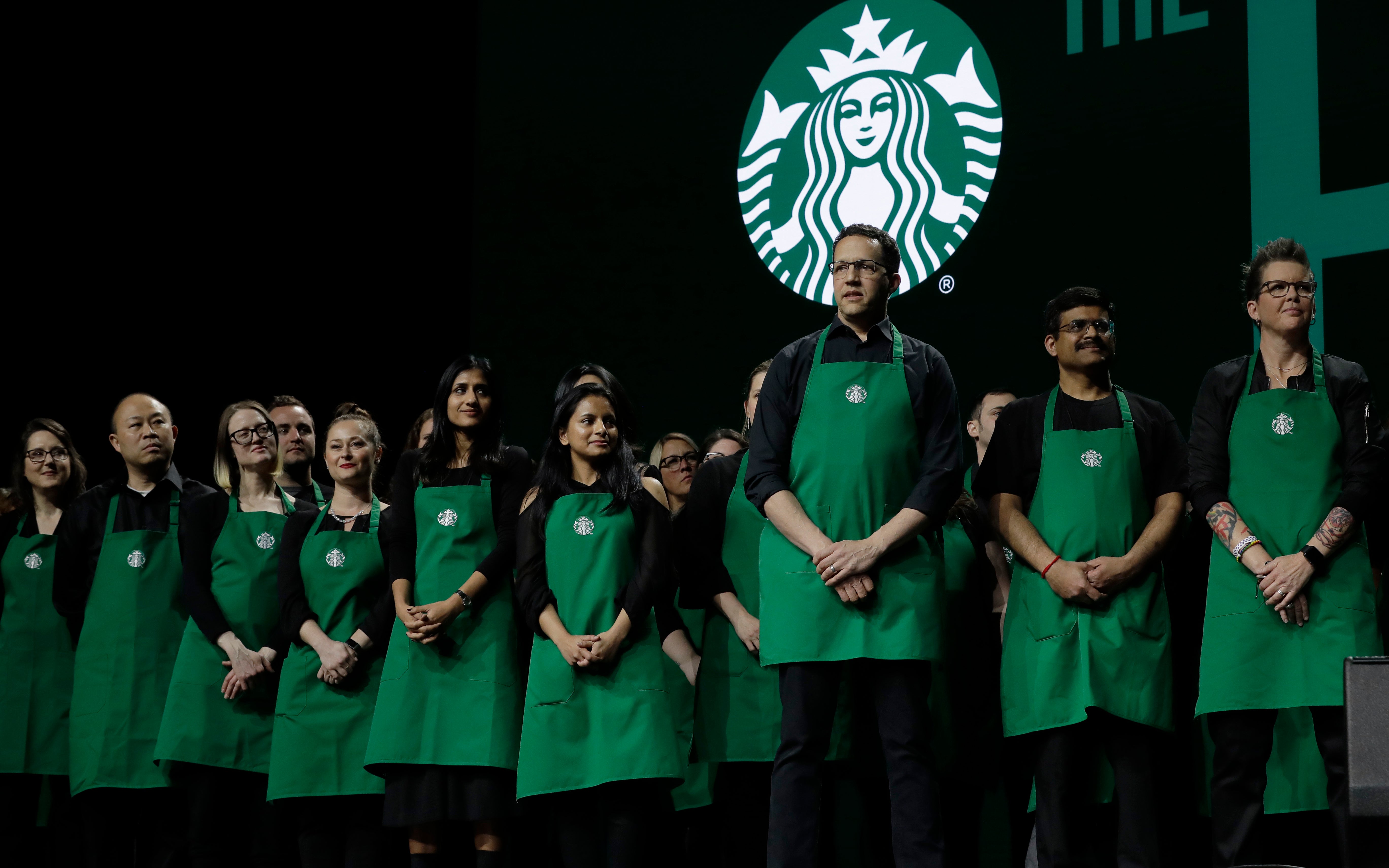 The new dress code at Starbucks requires employees to wear solid black shirts and bottoms limited to khaki, black, or blue denim