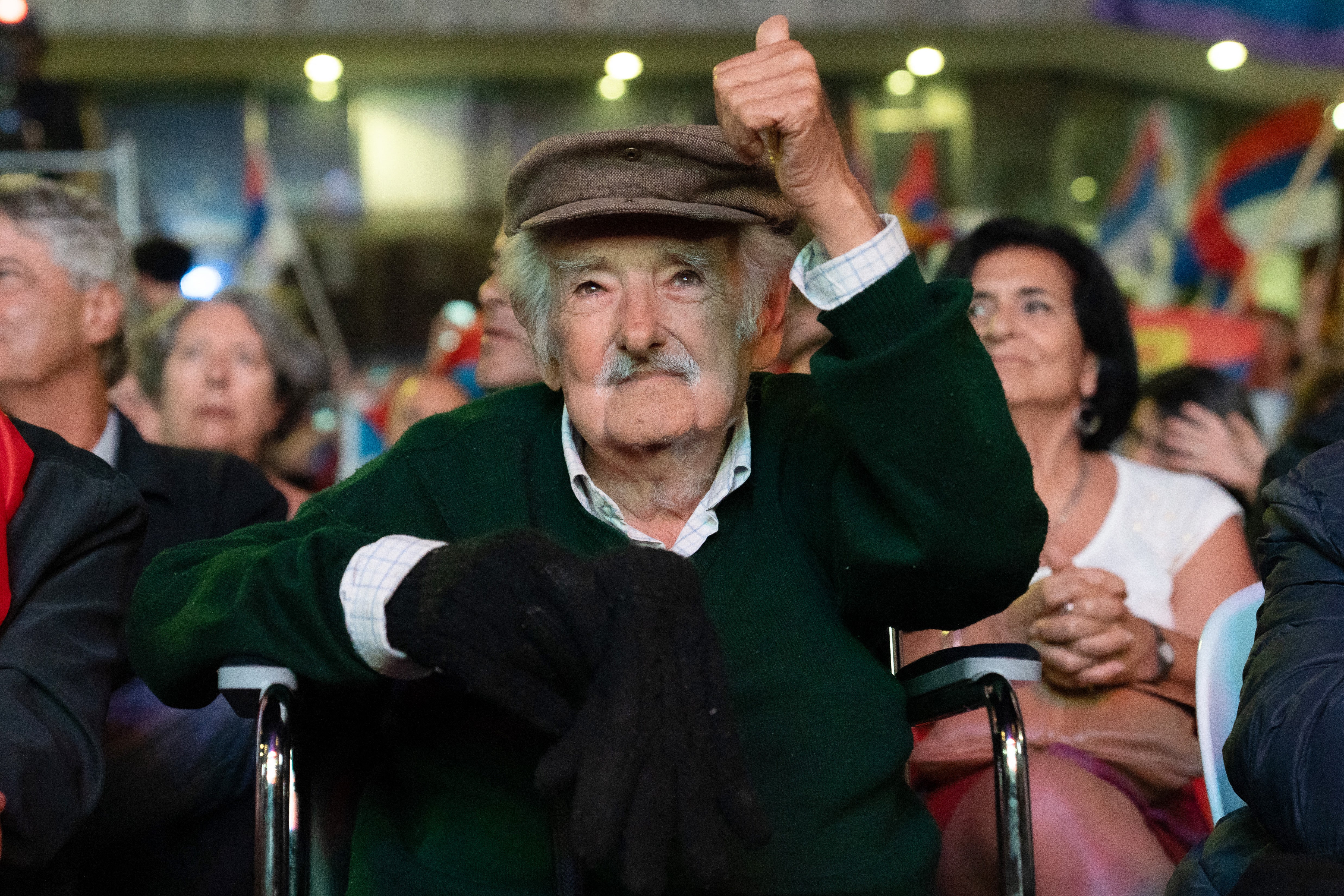 Former Uruguayan President Jose Mujica thumps up during the 54th anniversary of the Frente Amplio political coalition, in Montevideo on March 26, 2025