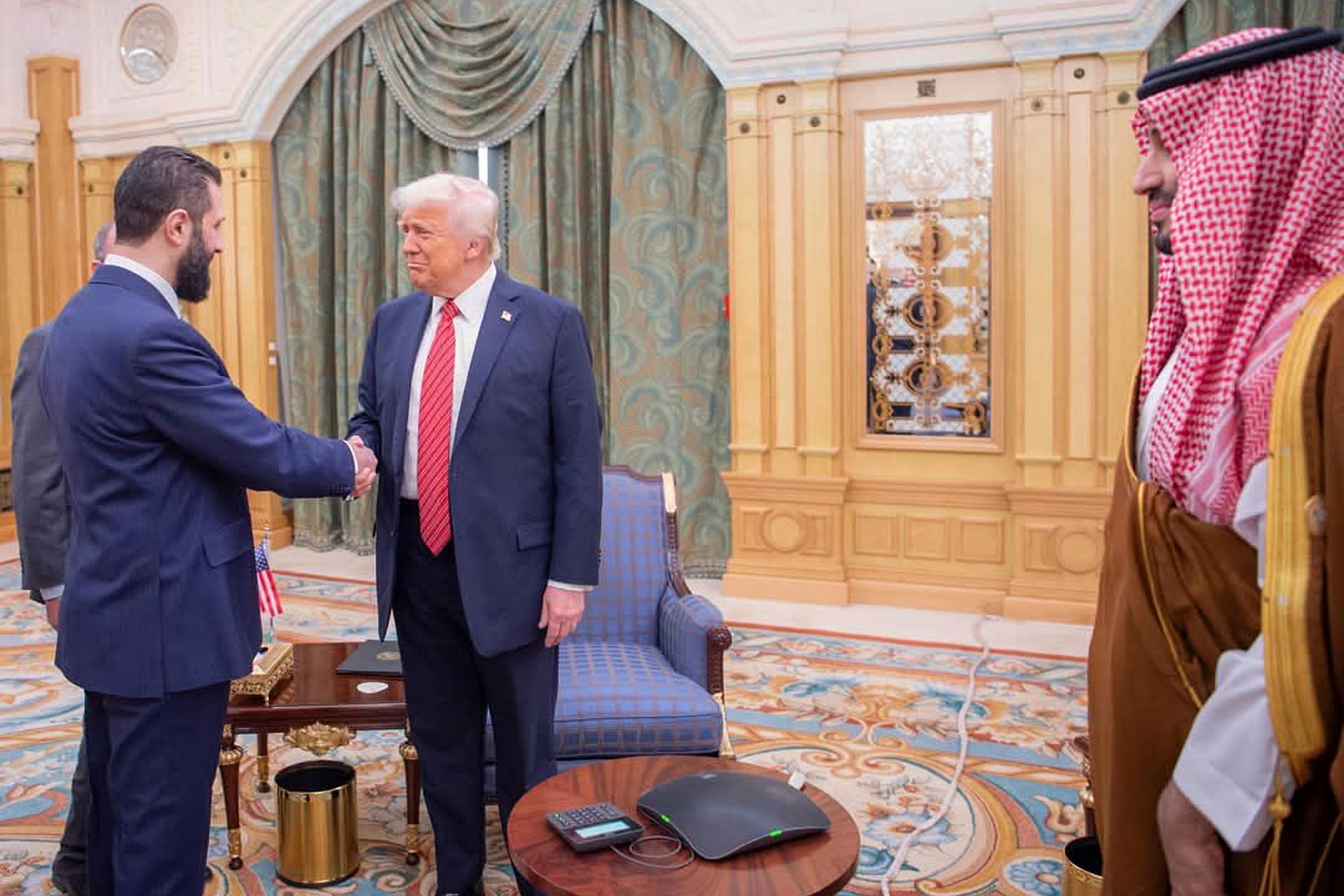 U.S. President Donald Trump meets with Syrian President Ahmed al-Sharaa in Riyadh, Saudi Arabia, in this handout released on May 14, 2025.