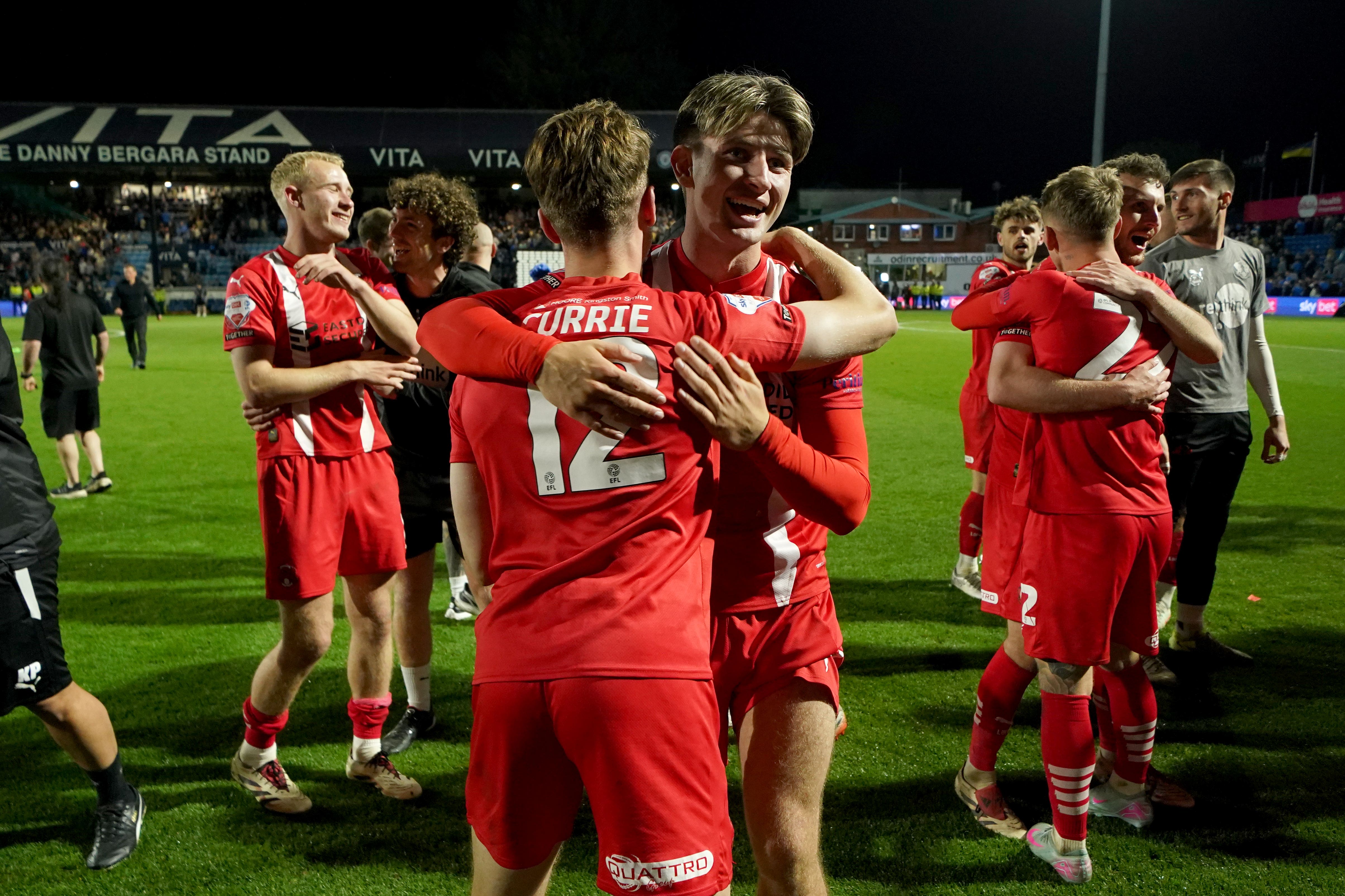 Leyton Orient’s Jack Currie (left) and Oliver O’Neill celebrate after the Sky Bet League One play off, semi-final, second leg match at Edgeley Park, Stockport (Martin Rickett/PA)