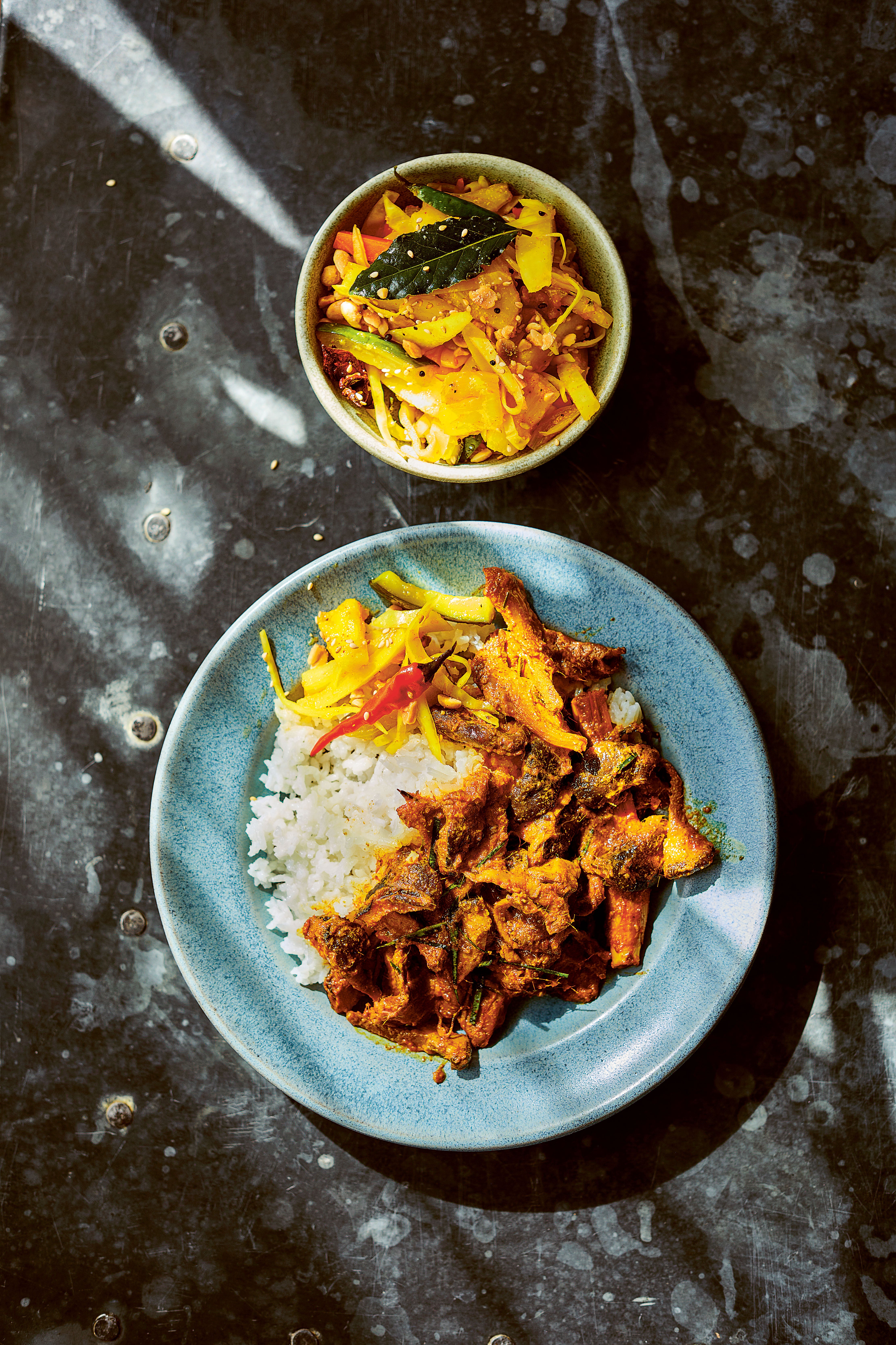 A slow-simmered masterpiece – this chicken rendang layers heat, sweetness and spice the way only a roti king could